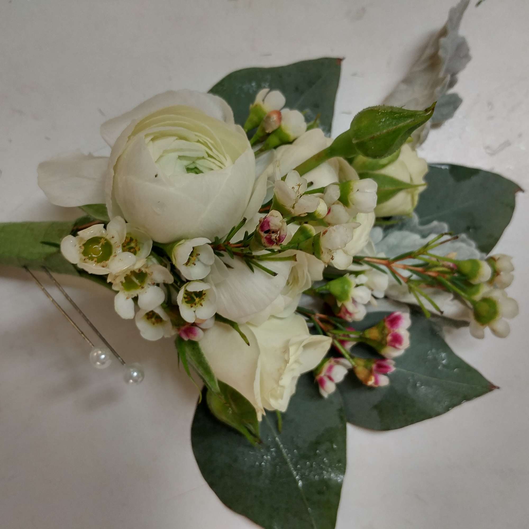 A classic white boutonni&egrave;re that compliments any suit. A perfect addition for