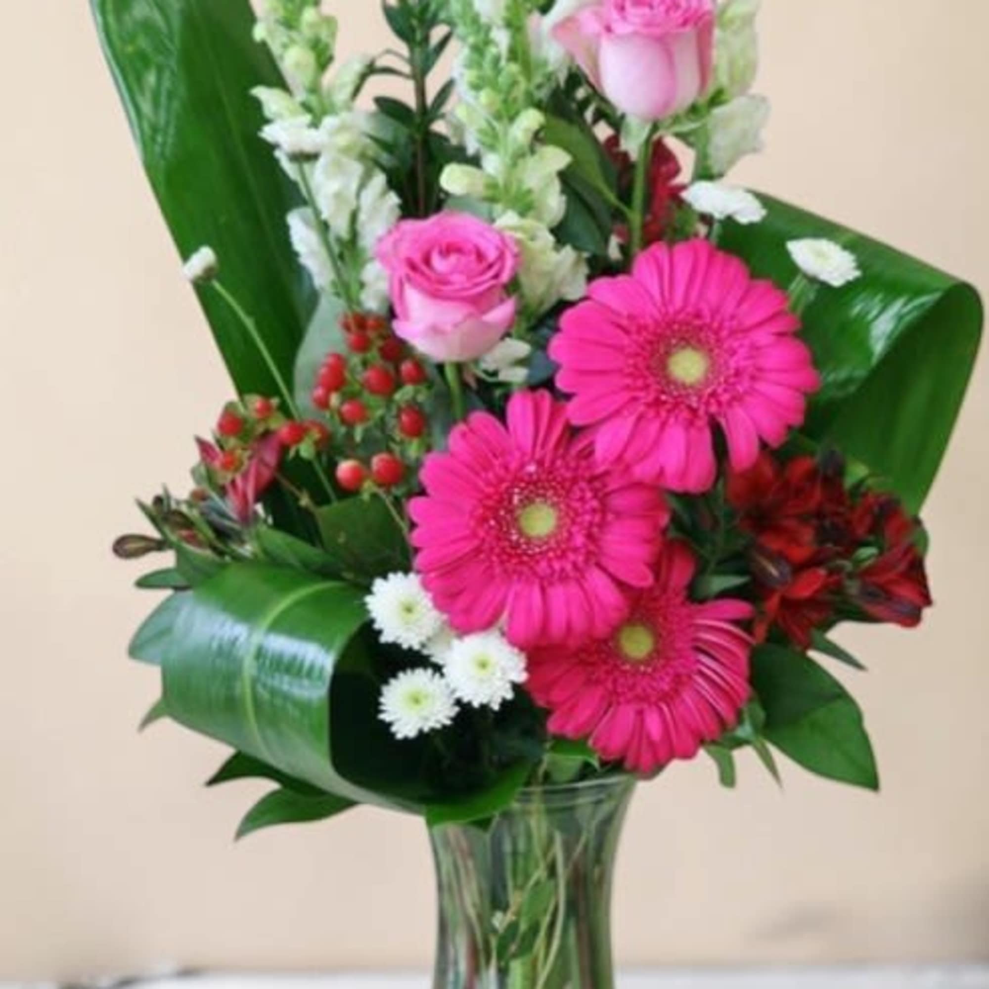 
This vibrant floral design showcases a lively mix of pinks, whites, and