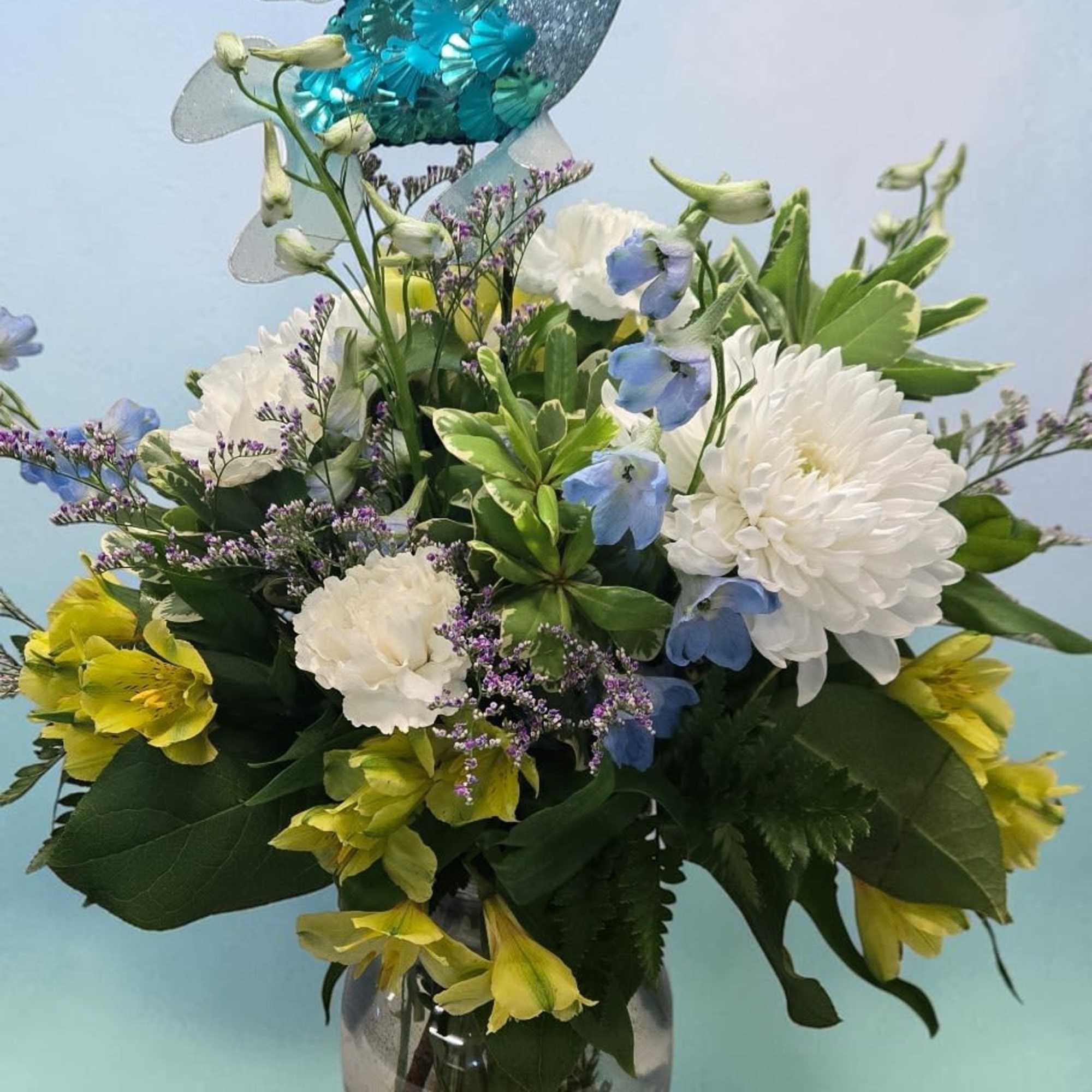 A whimsical fish ornament with iridescent blue and silver scales, suspended above, photo 4 of 4