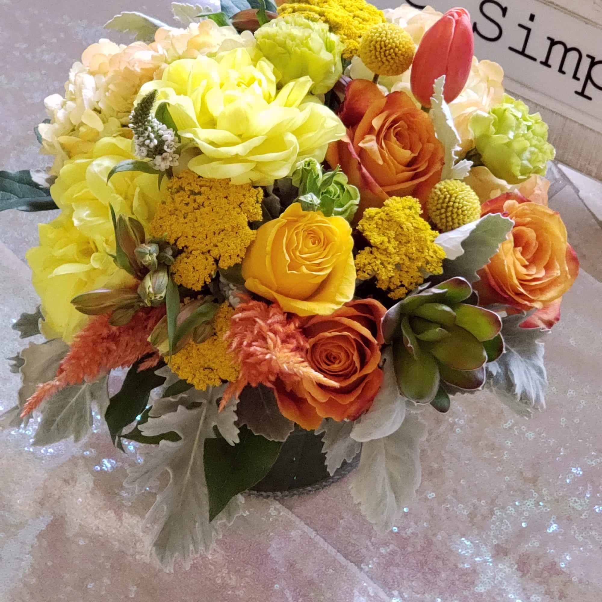 Bouquet of yellow and orange flowers with tulips and roses