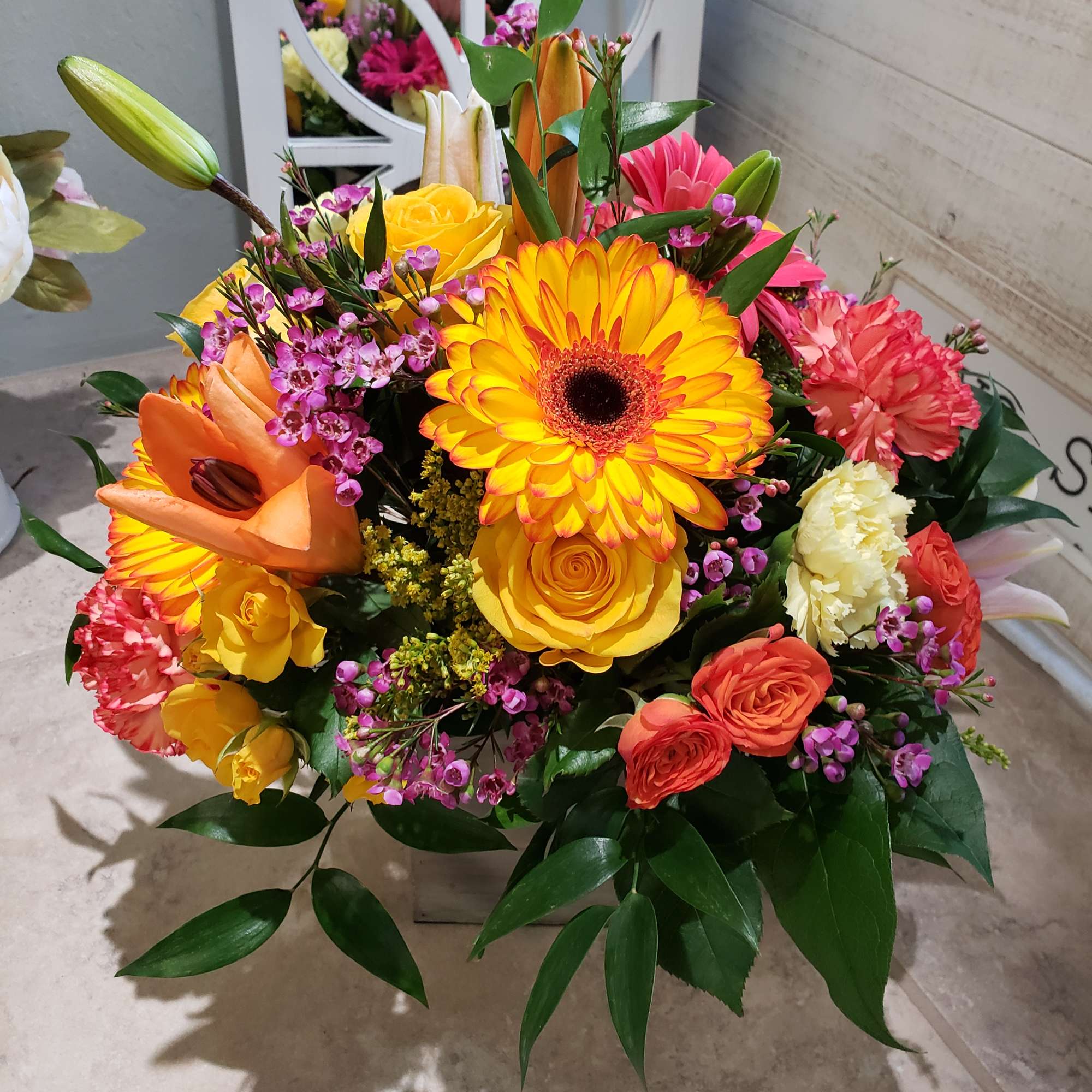 Bright mixed bouquet with gerbera daisies, roses, lilies, and carnations