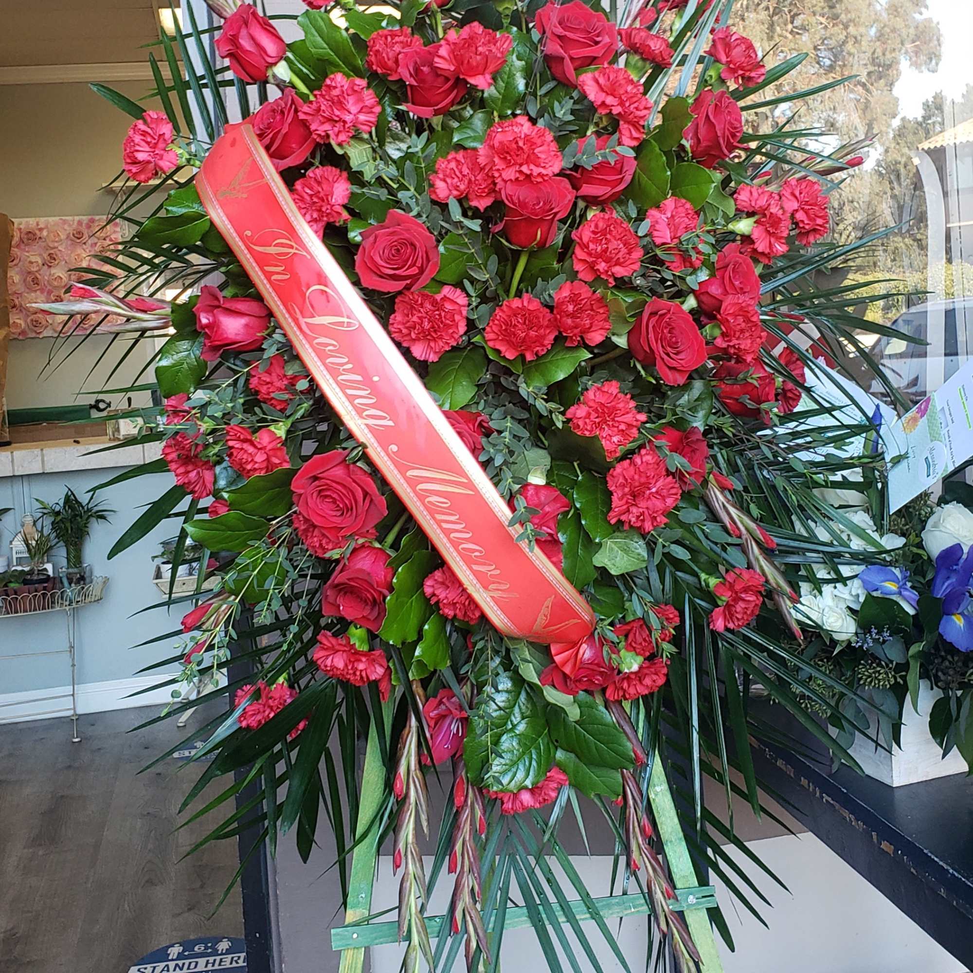 Red is the color of love and this standing spray displays it, photo 2 of 2