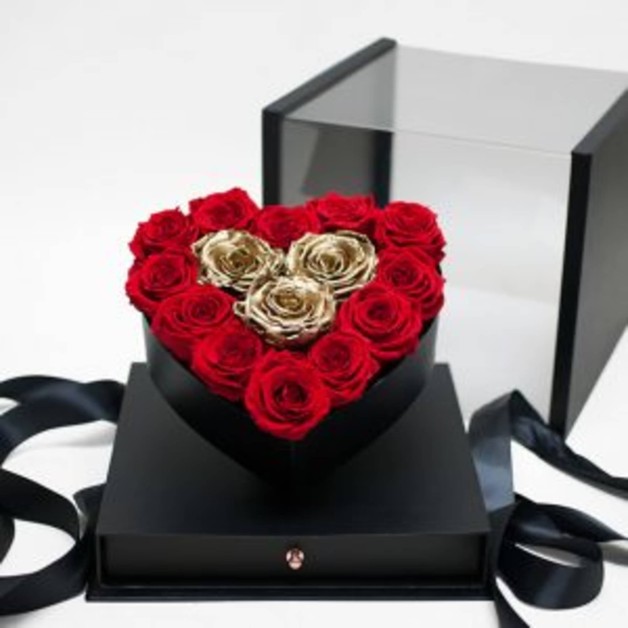 Heart-shaped box of red and gold roses