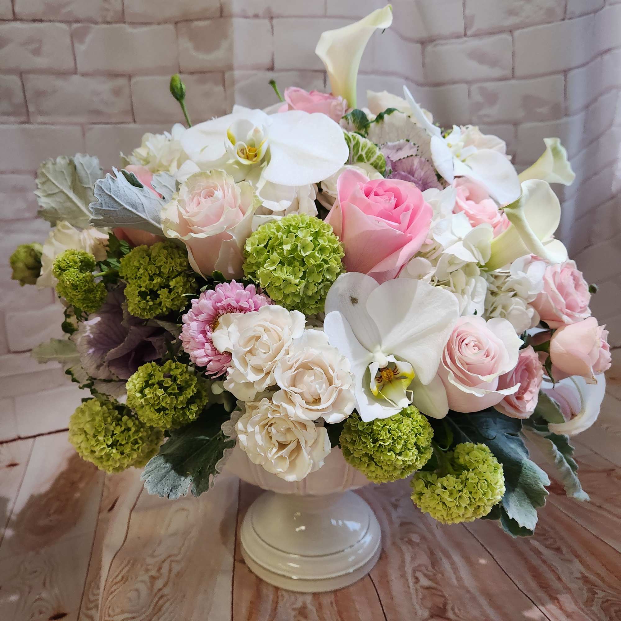 Pink and white floral arrangement in a white pedestal vase, photo 2 of 6