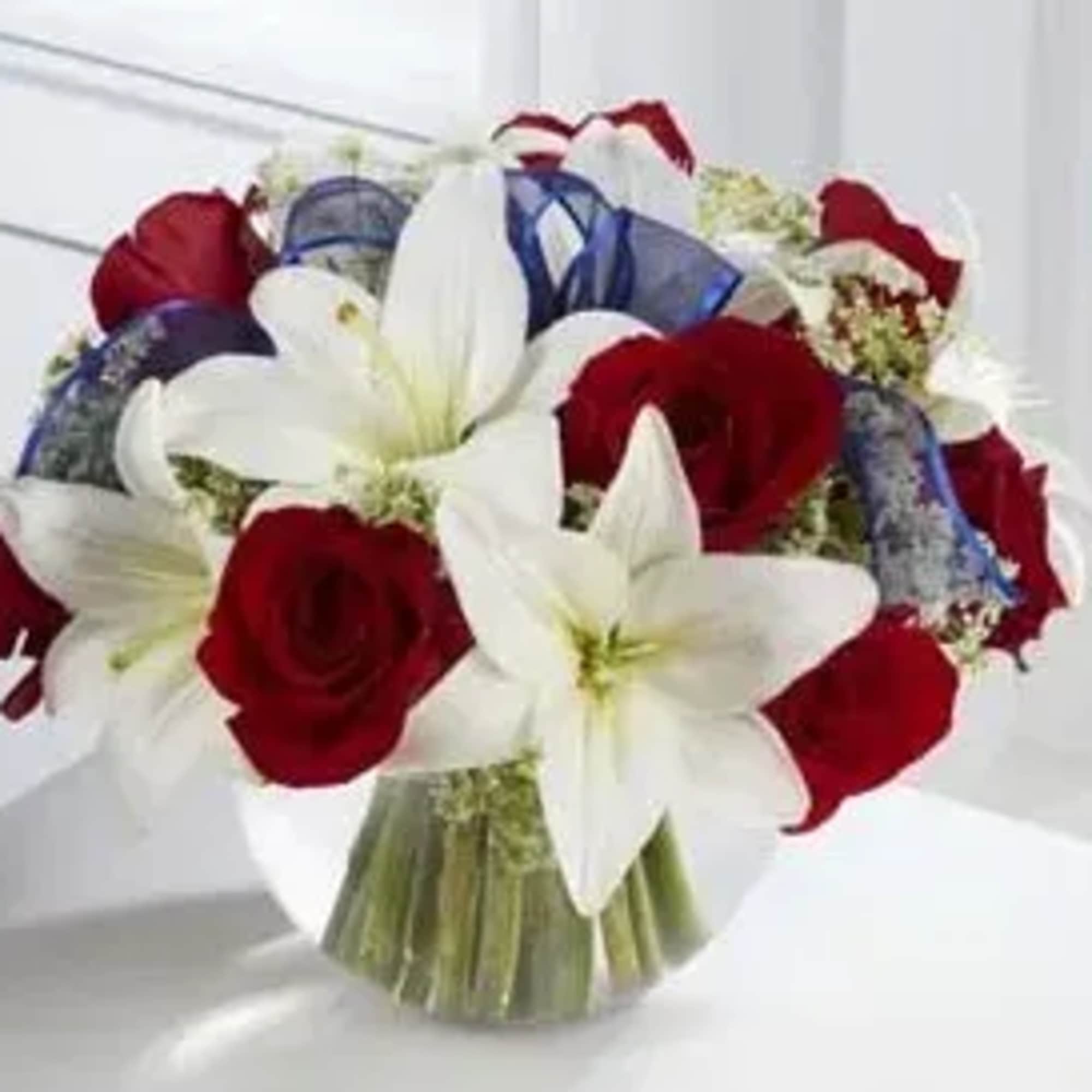 Bouquet of red roses and white lilies in clear wrapping