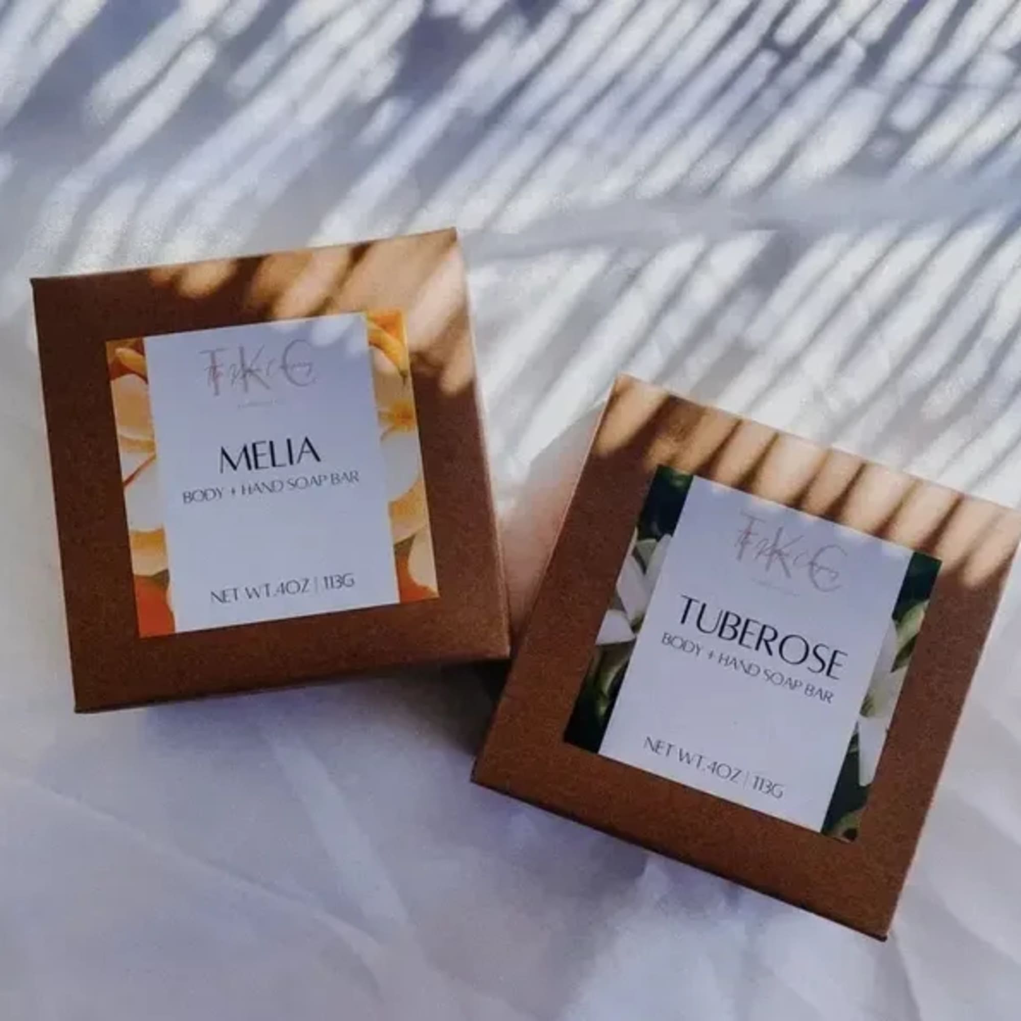 Two boxed body and hand soap bars labeled Melia and Tuberose