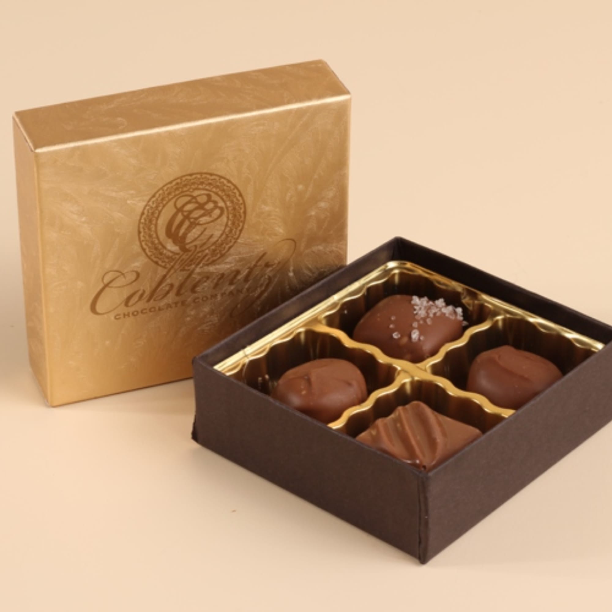 Box of assorted chocolates in a gold and brown gift box