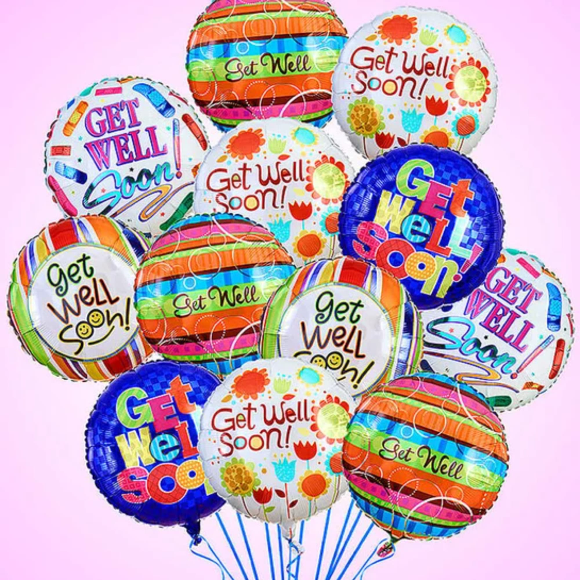 Cluster of colorful get well soon balloons on a pink background