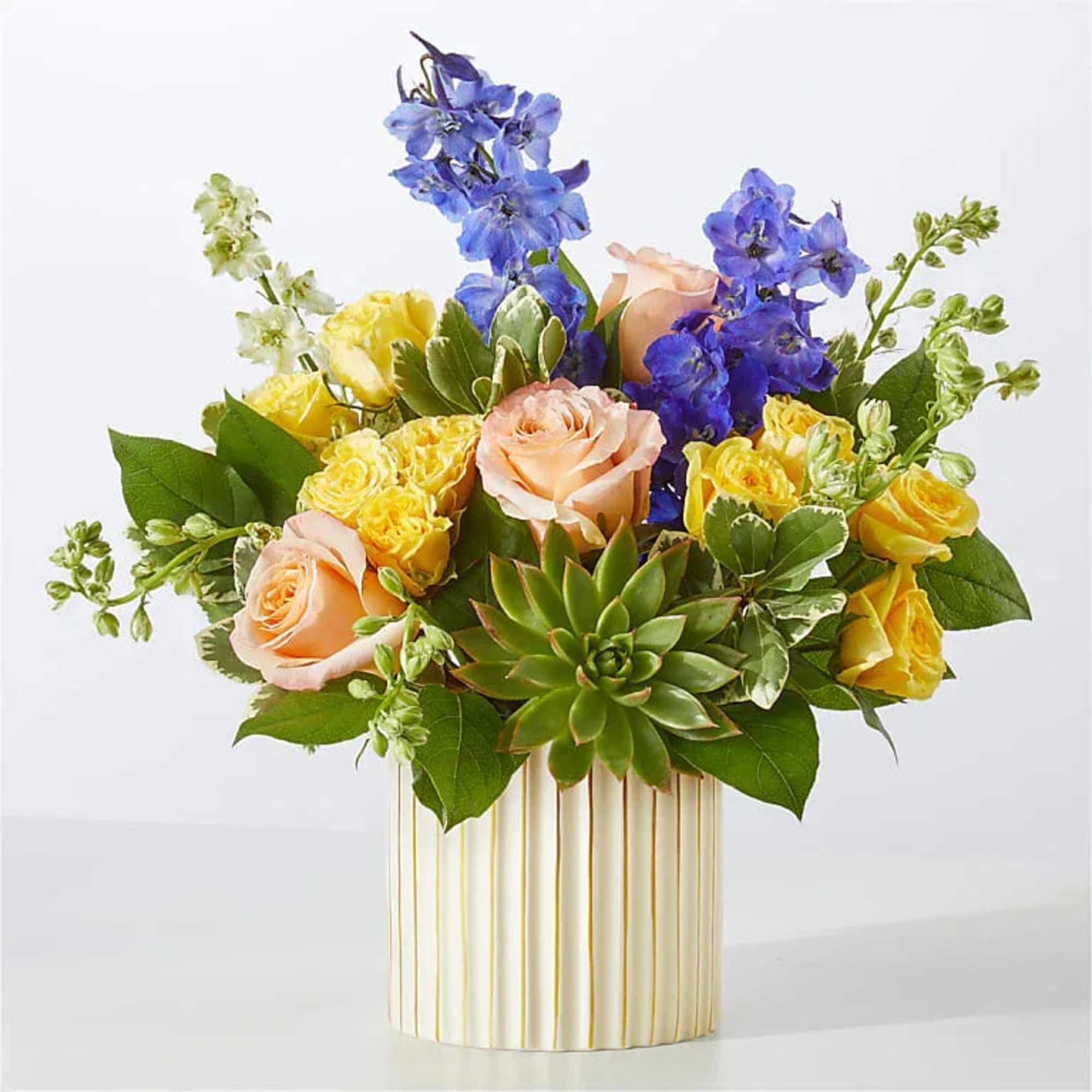 Get swept away by this daydream of a bouquet, arranged with peachy