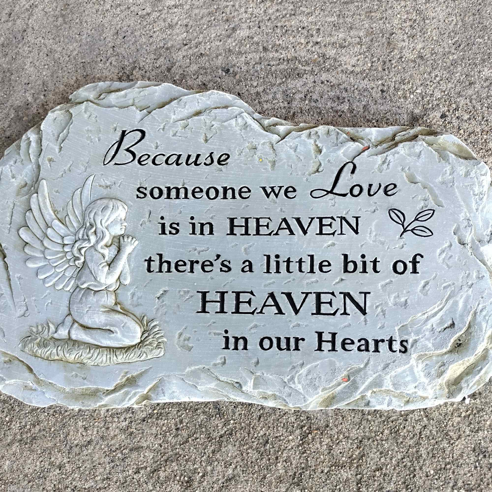 Memorial stone with an angel and a sympathy quote