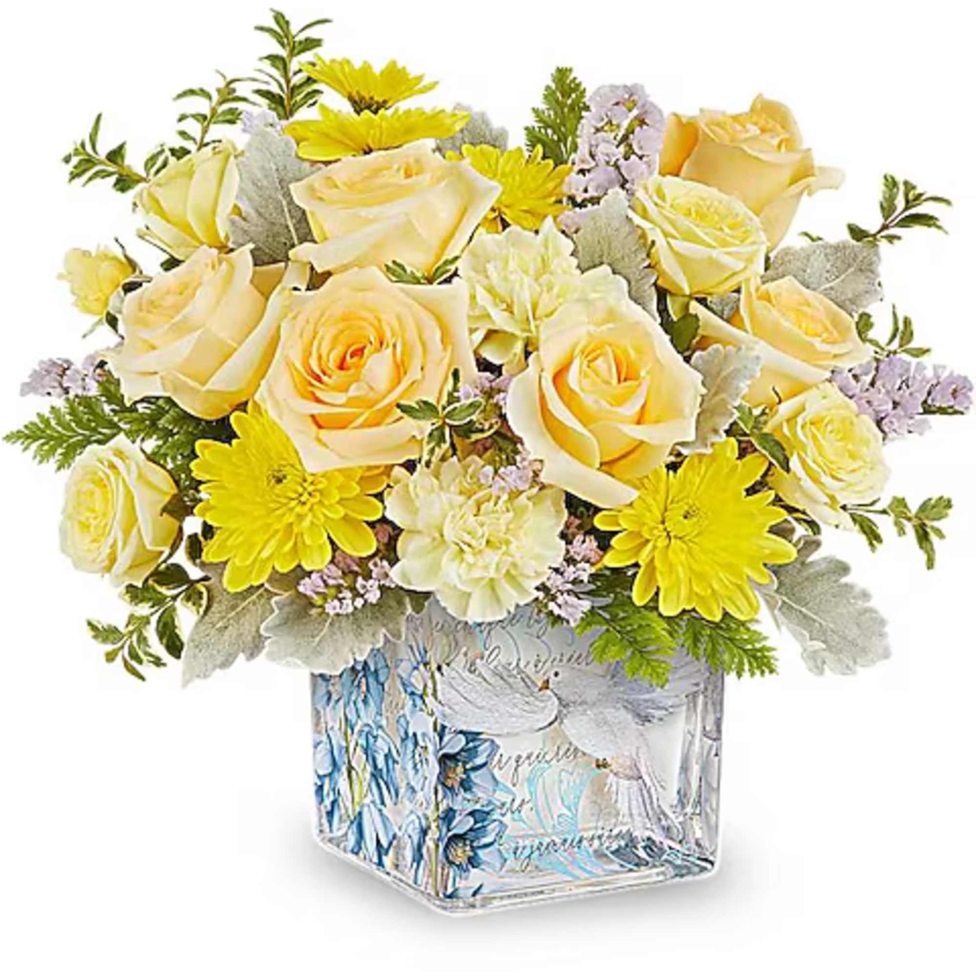 Yellow and cream flower arrangement in a decorative glass vase