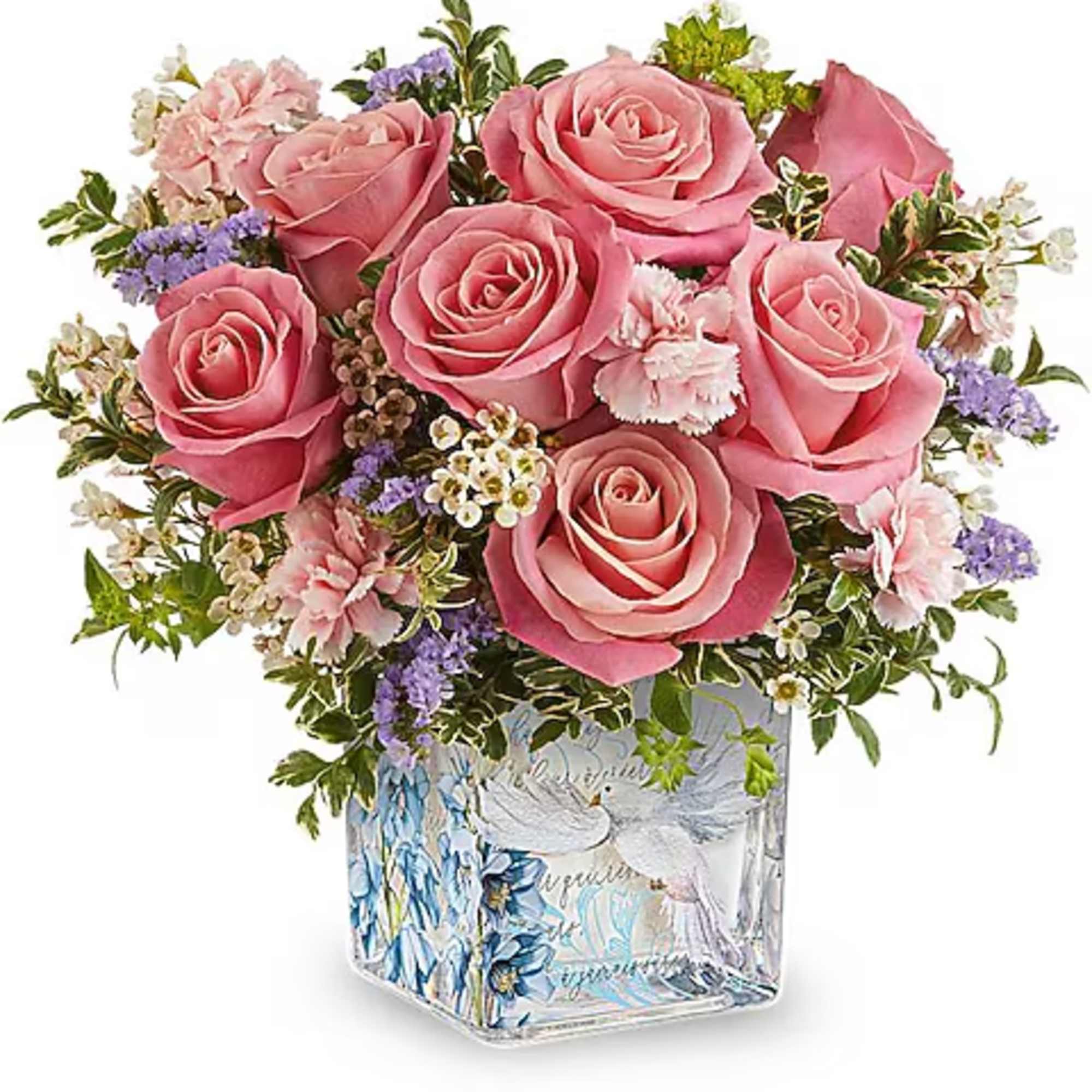 Pink roses and small mixed flowers in a decorative glass vase