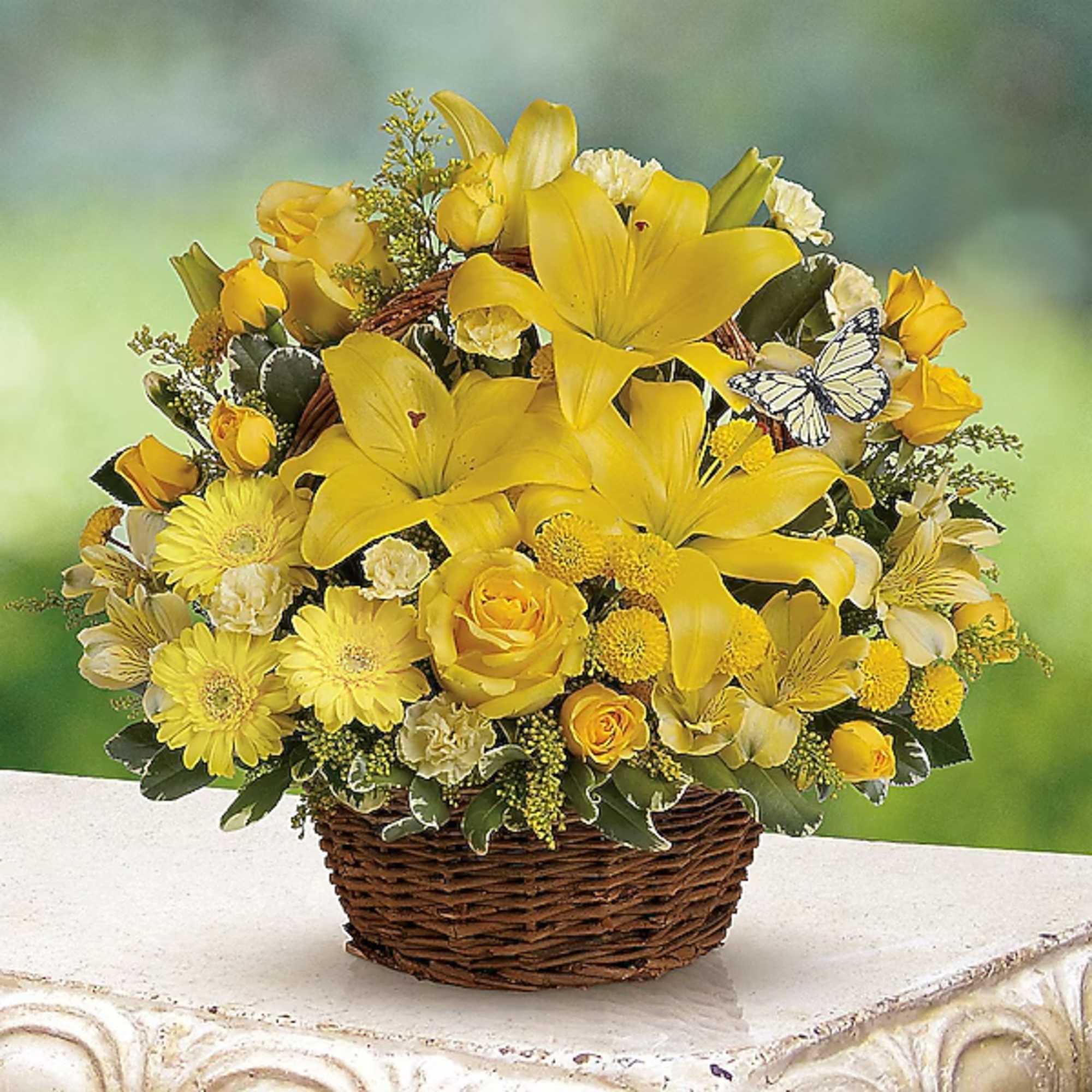 Yellow floral basket arrangement with lilies and roses