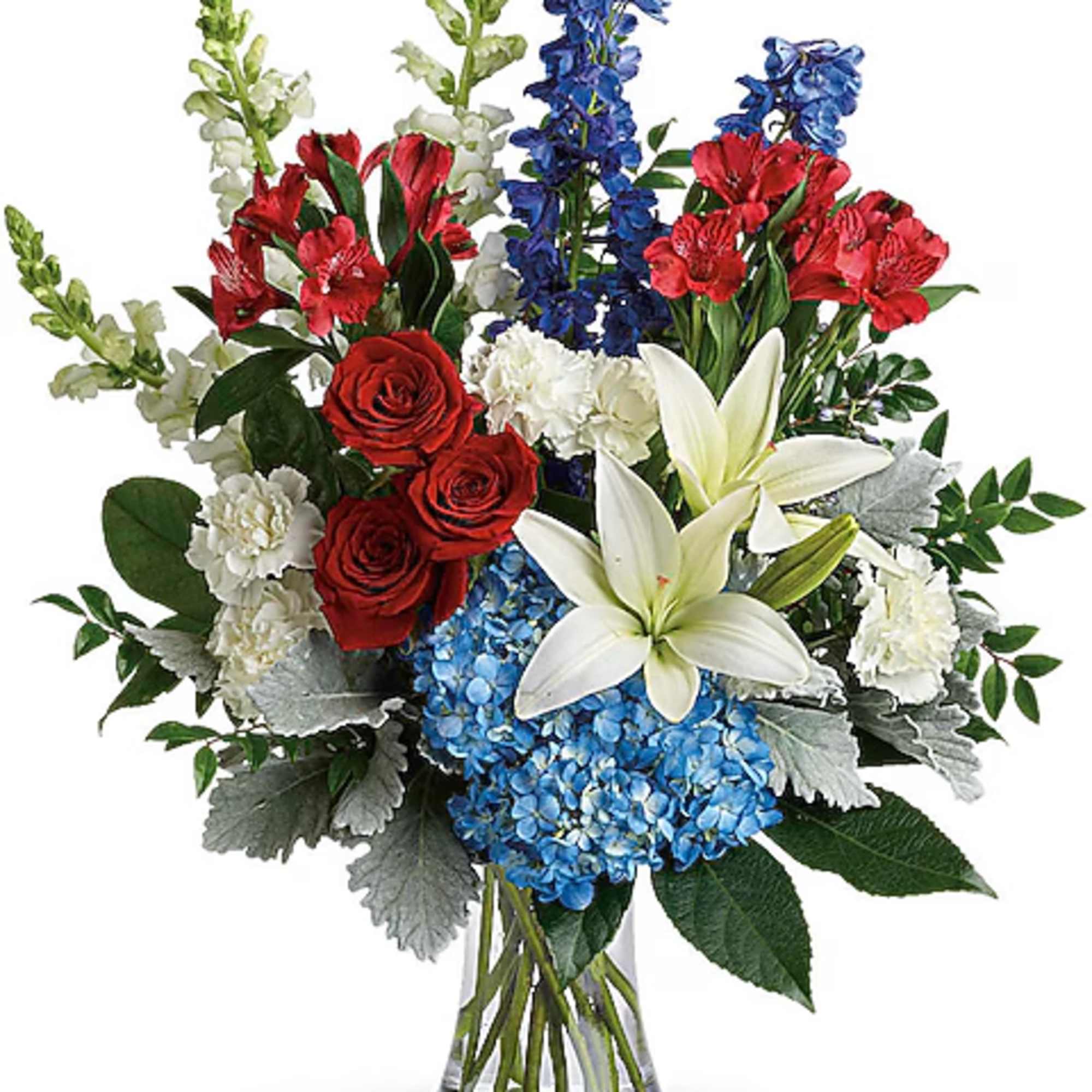 Mixed bouquet with red roses, white lilies, blue hydrangeas, and snapdragons in a glass vase