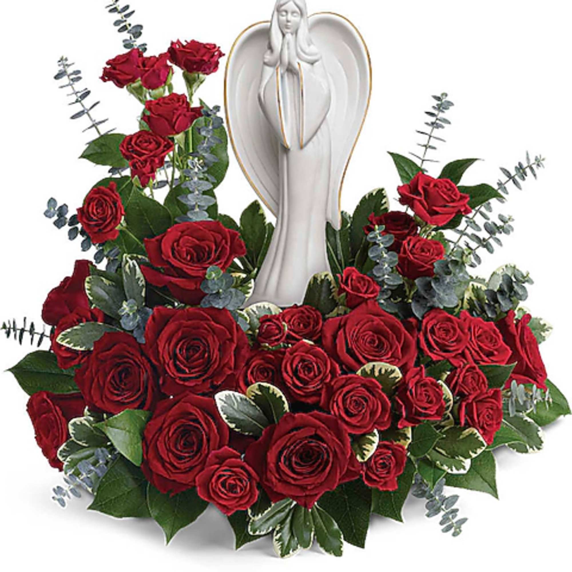 Red roses arranged around a white angel figurine