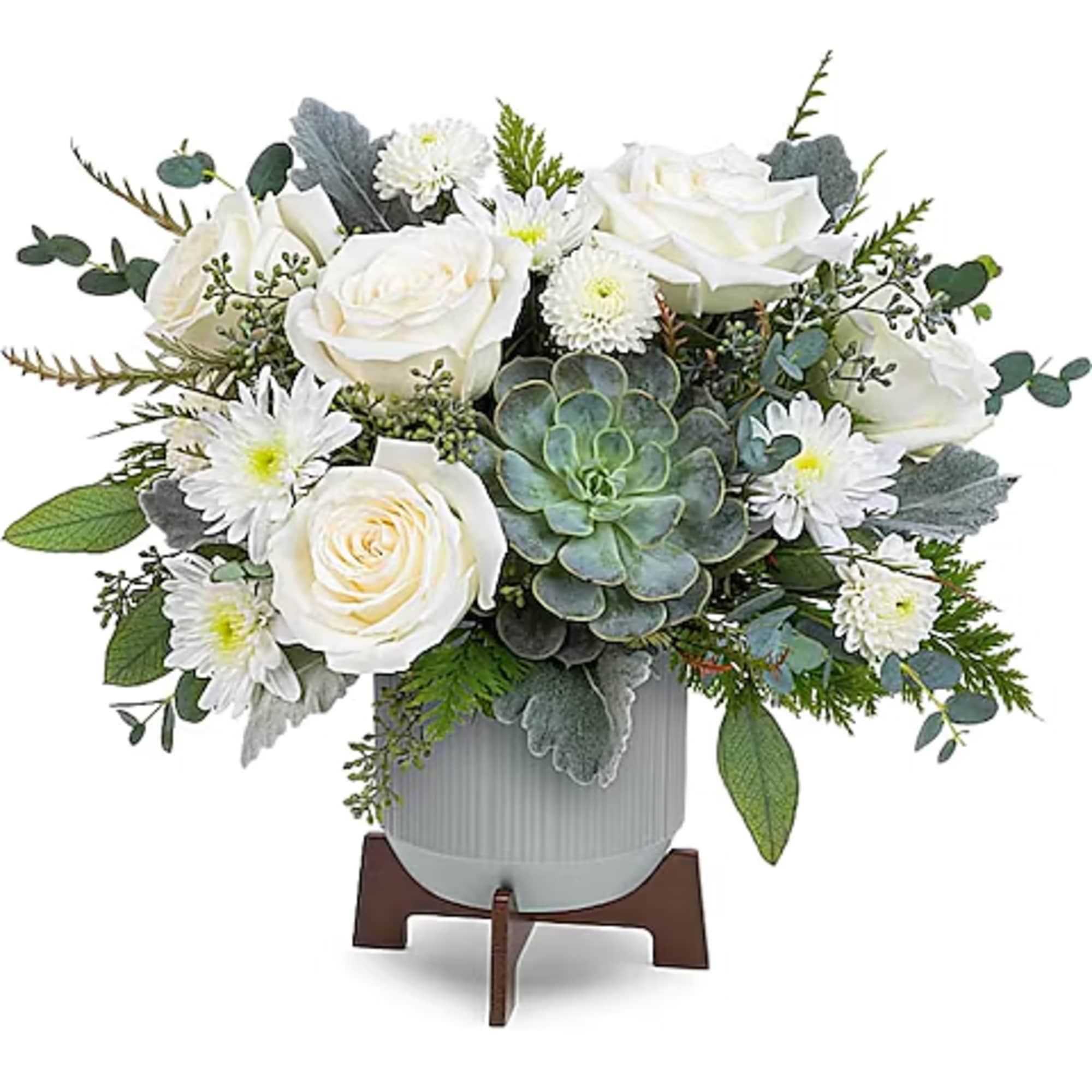 White roses and daisies arranged with a succulent in a gray vase