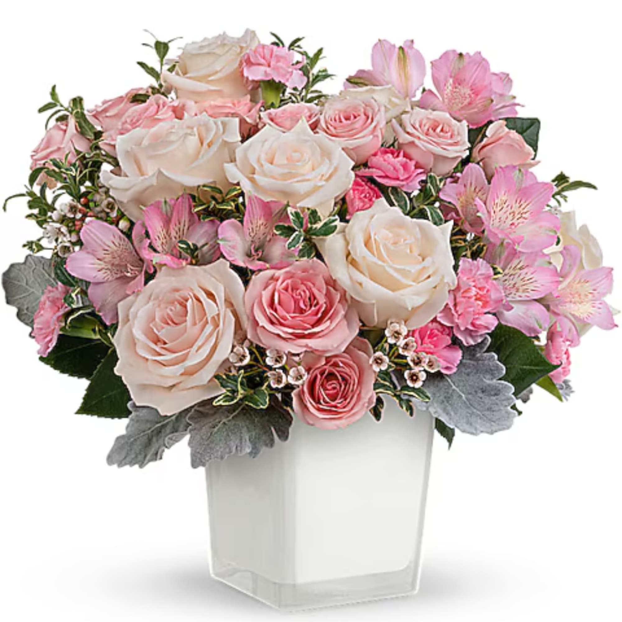 Pink and white rose bouquet in a clear square vase