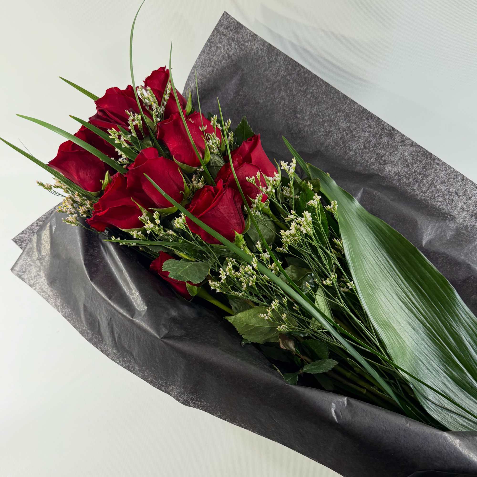 Surprise someone special with a bouquet of roses which they can arrange