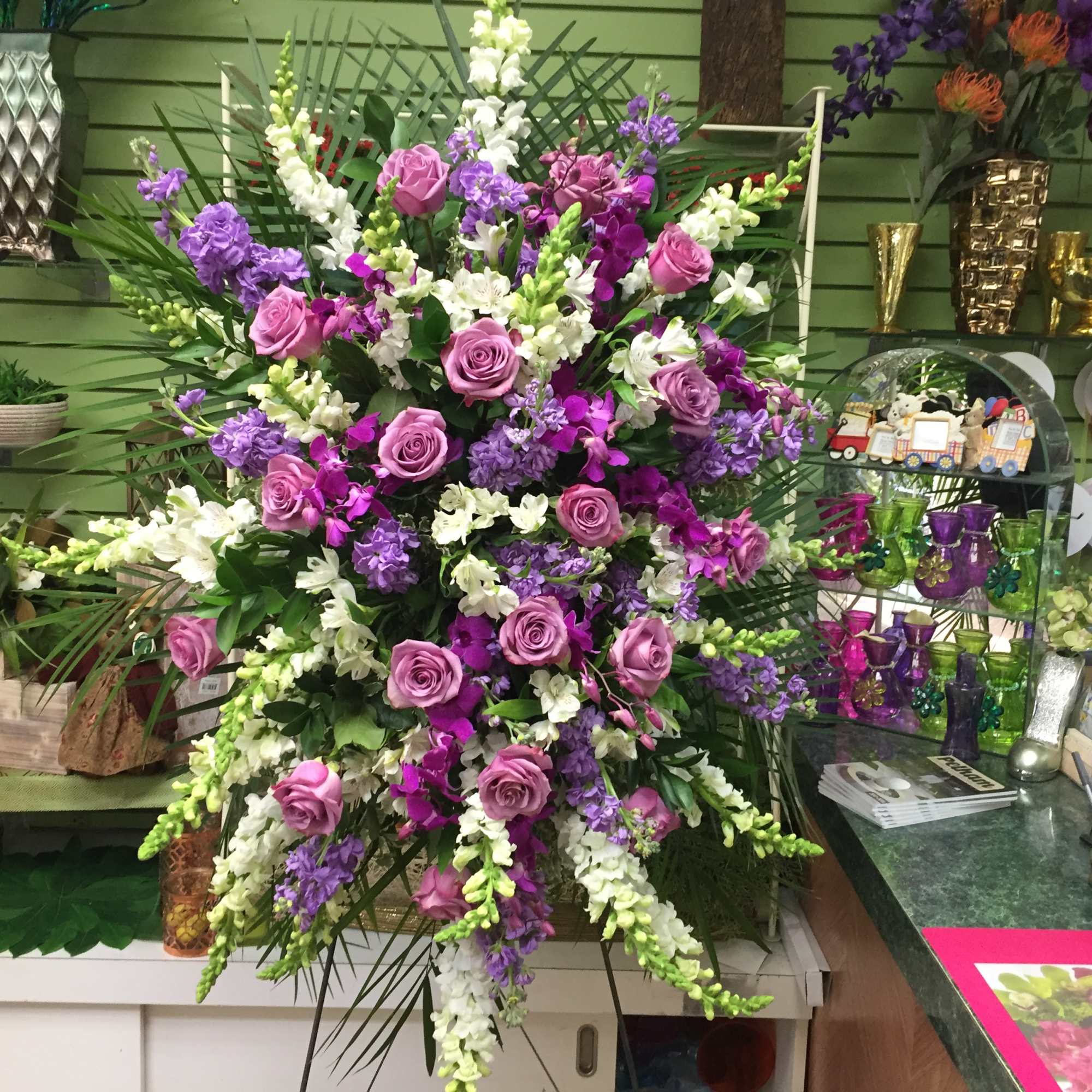 Large standing floral spray with pink roses and purple-white blooms