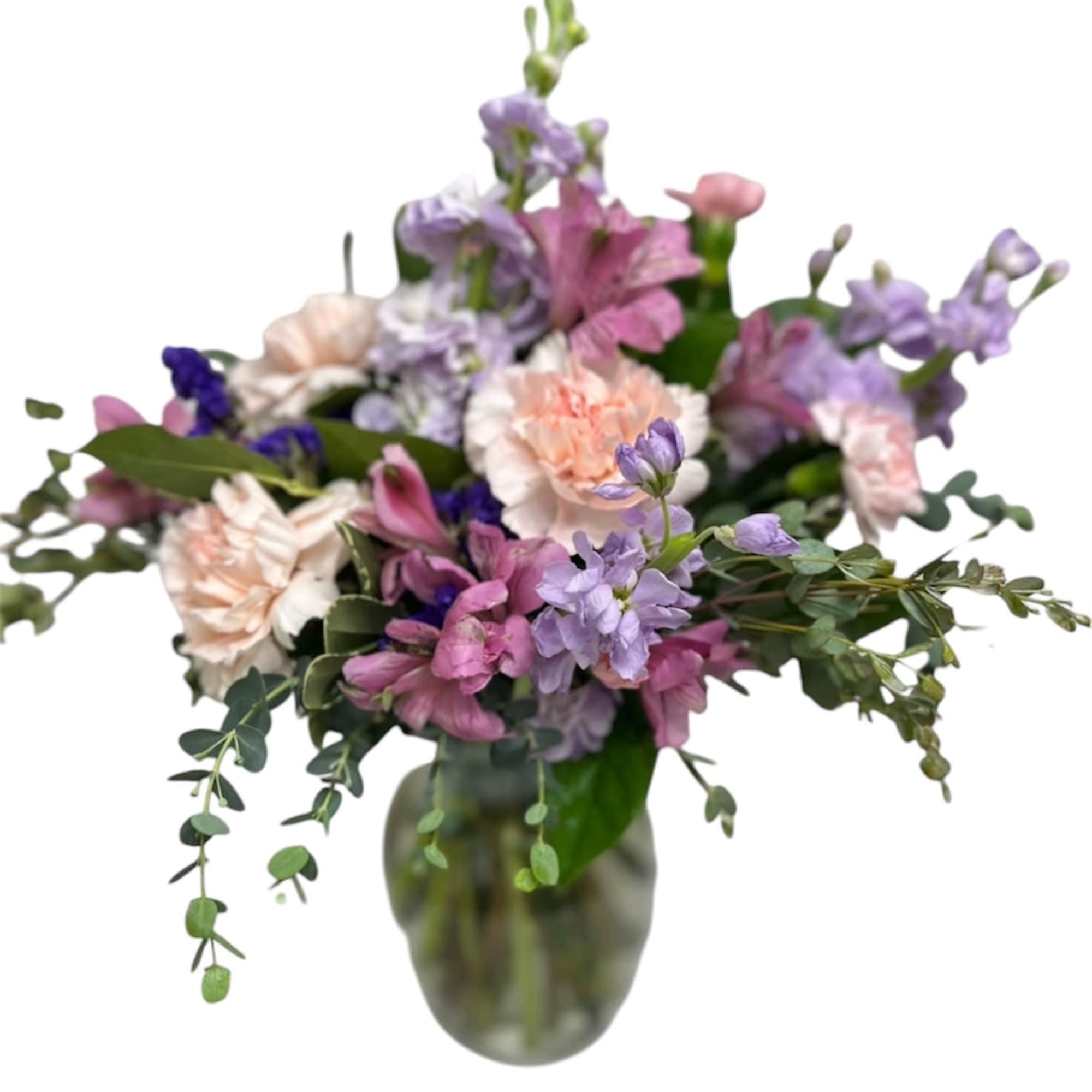 Mixed pastel bouquet in a glass vase
