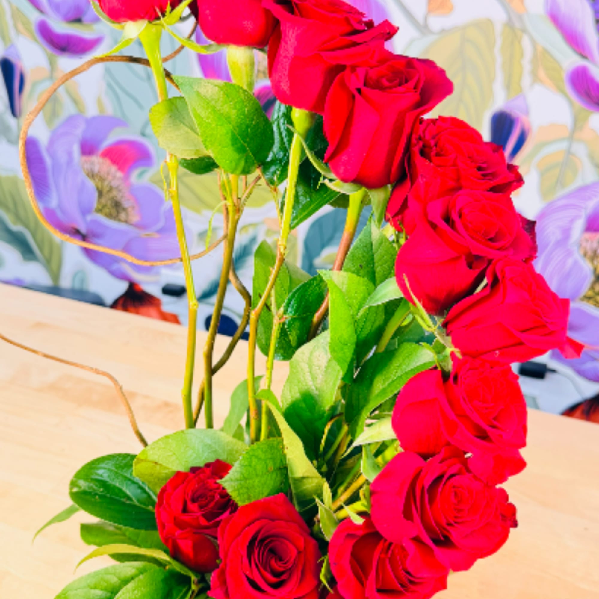 A dramatic column of vivid red roses draws the eye upward in, photo 2 of 2