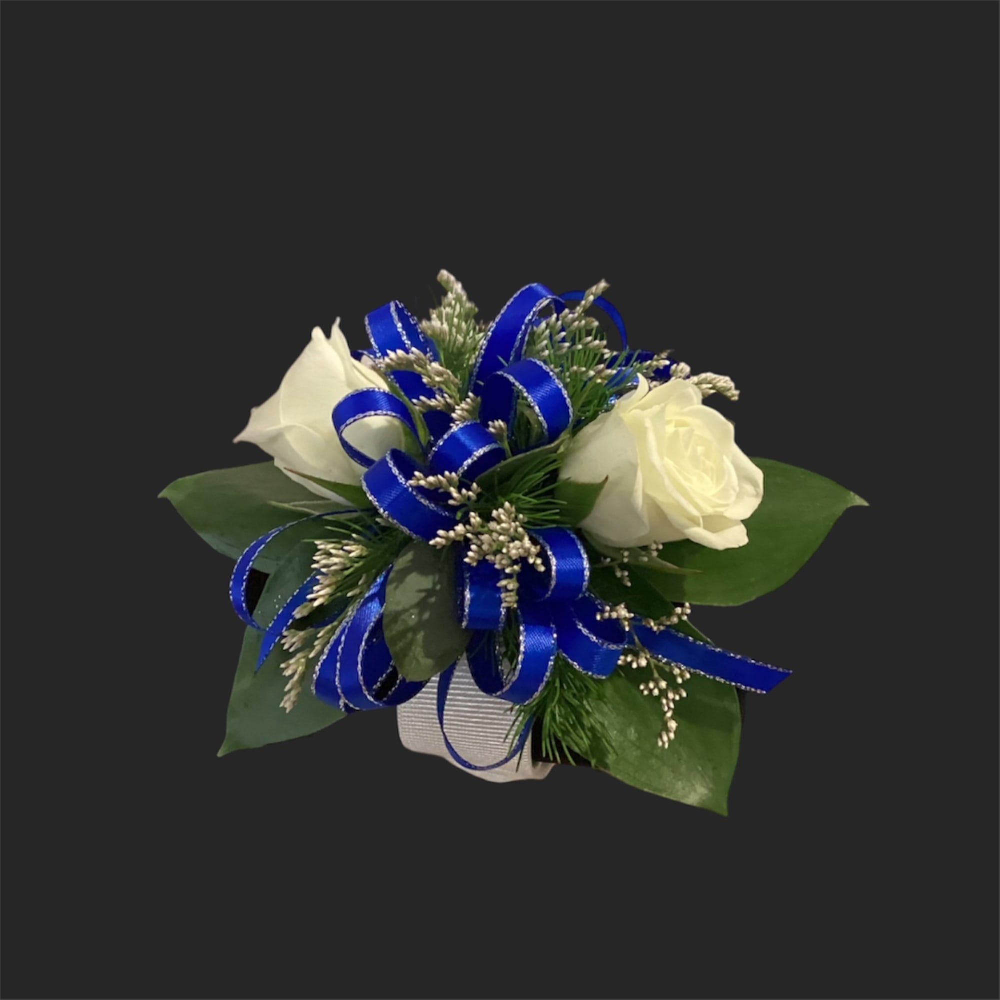 White rose boutonniere with blue ribbon and greenery