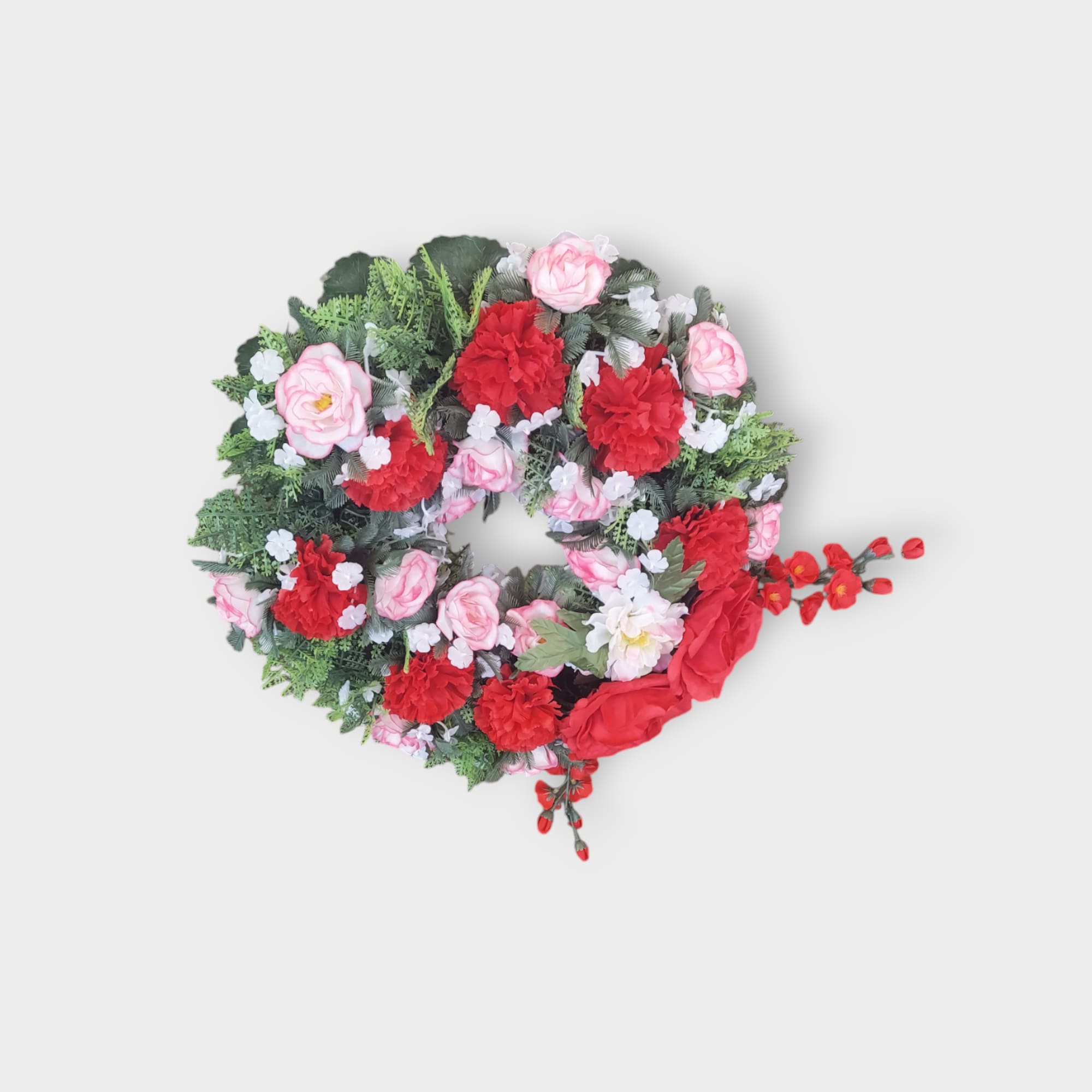 This artificial wreath is perfect for placement on a grave or memorial