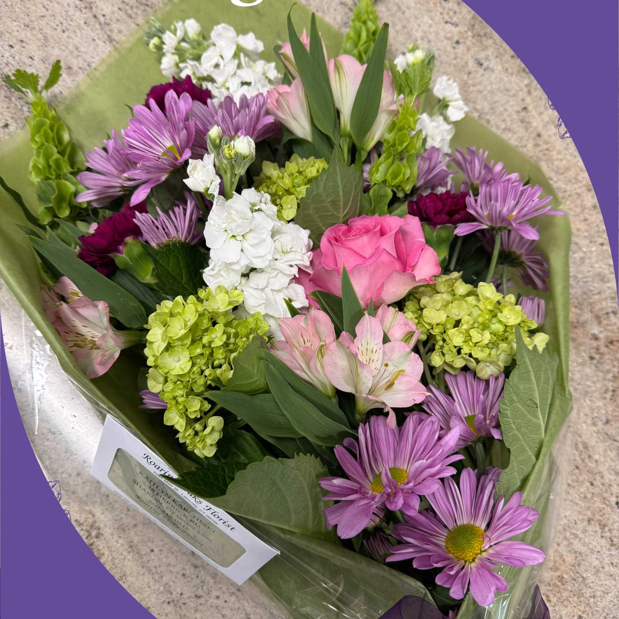 Wrapped bouquet of pink, purple, white, and green flowers, photo 2 of 2