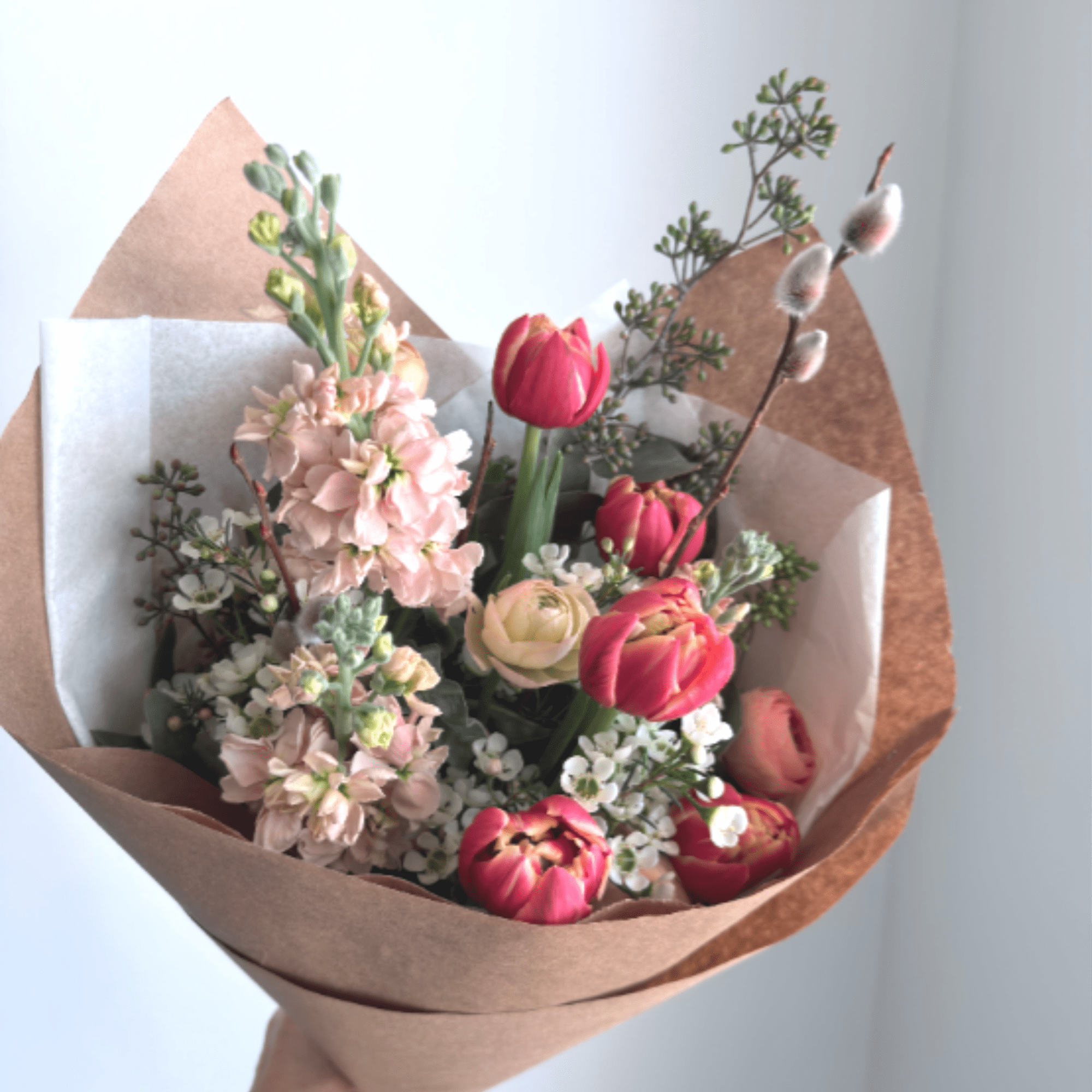 Share your love with this soft mixed wrap bouquet. Filled with fragrant