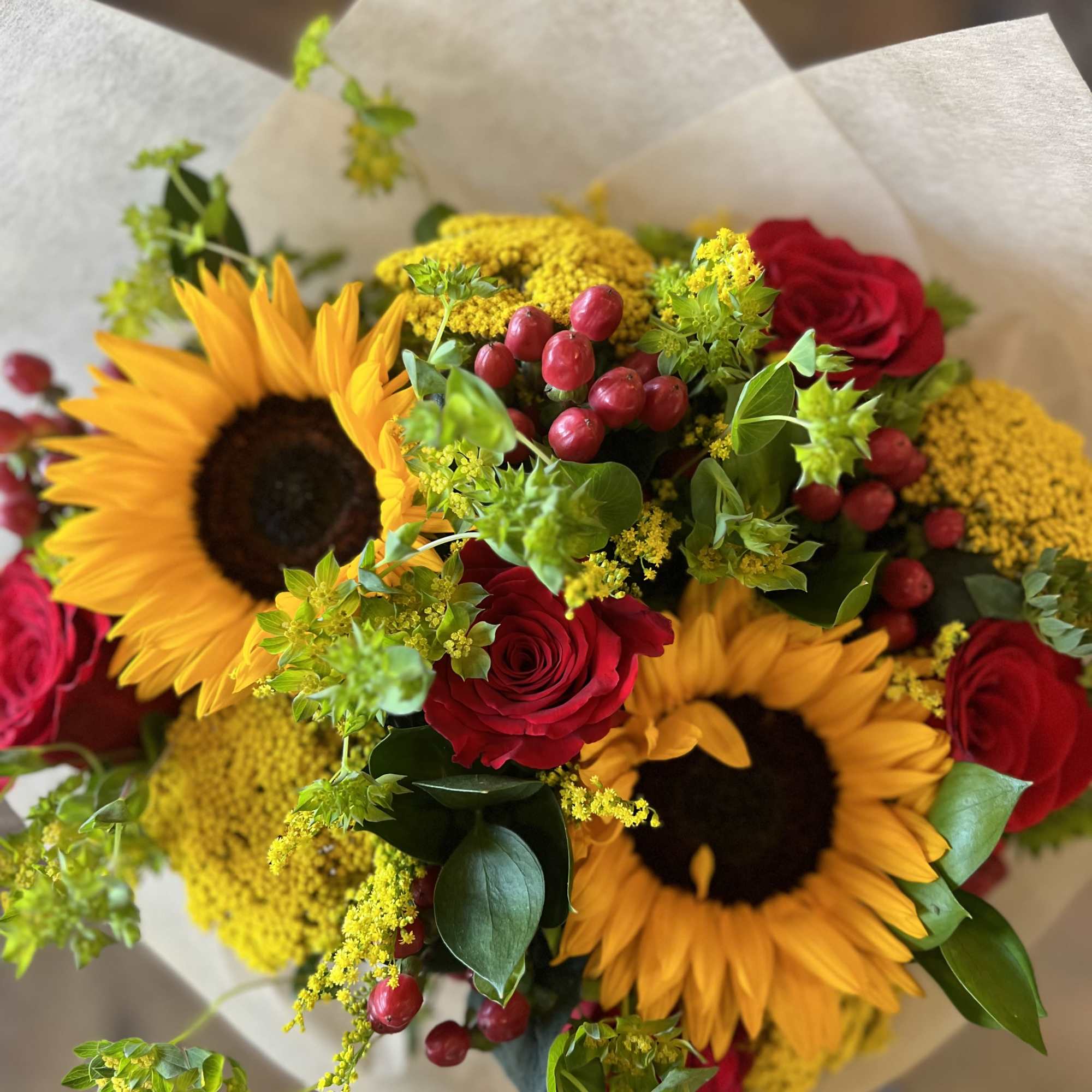 Romantic red roses complimented with cheerful sunflowers, red hypericum berries, yarrow, and, photo 2 of 2