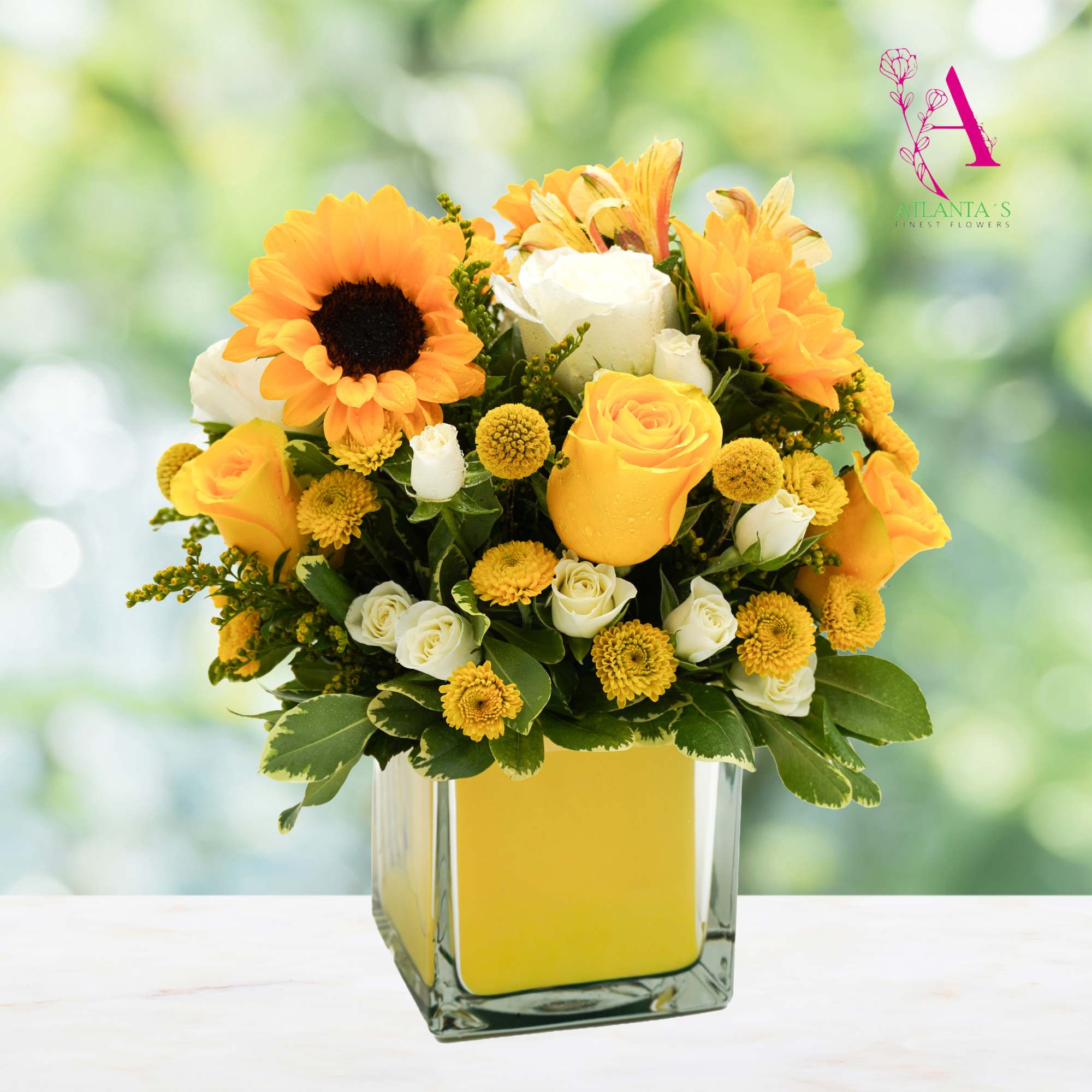 Yellow and white bouquet with sunflowers and roses in a glass vase