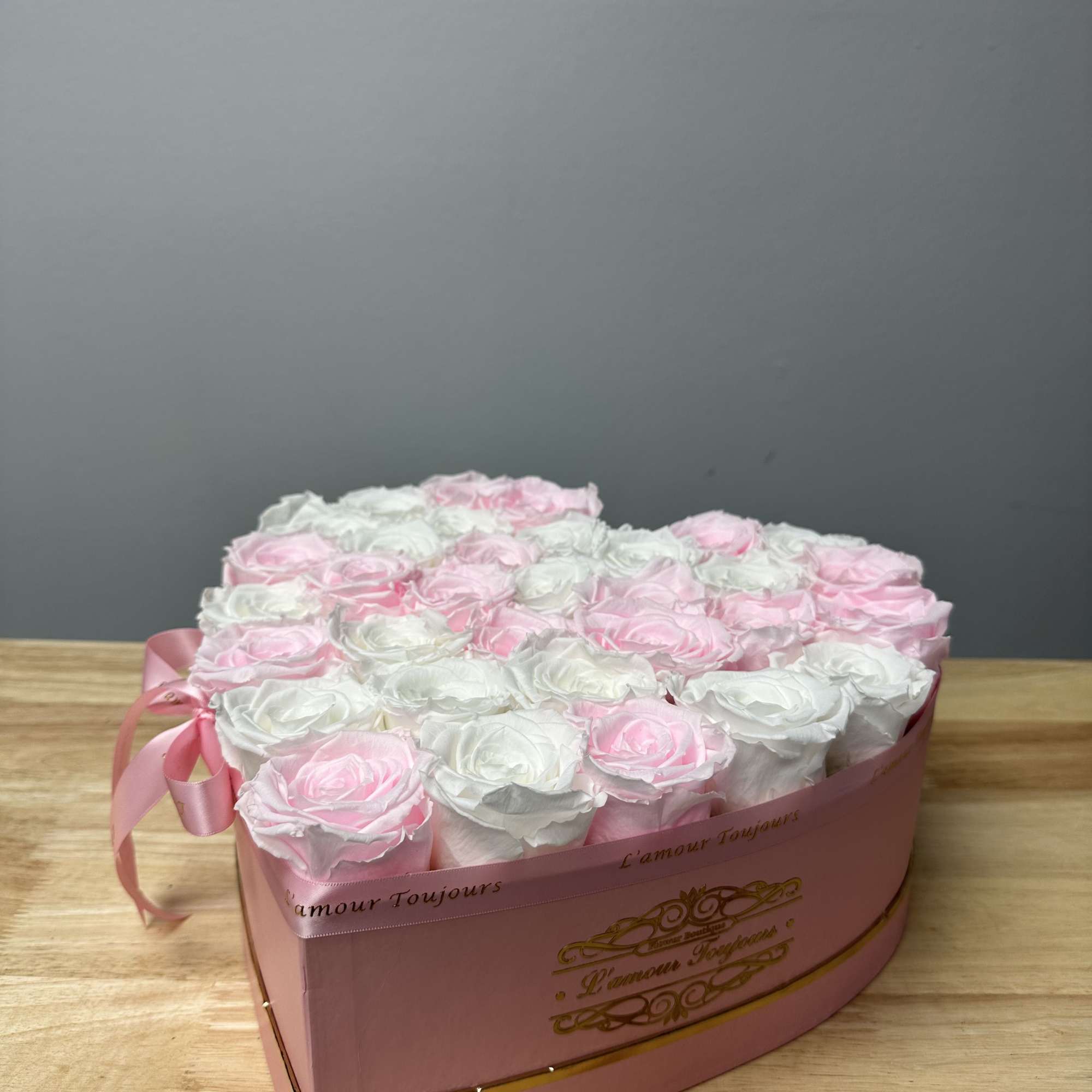 Heart-shaped box of pink and white roses with a ribbon bow, photo 2 of 2