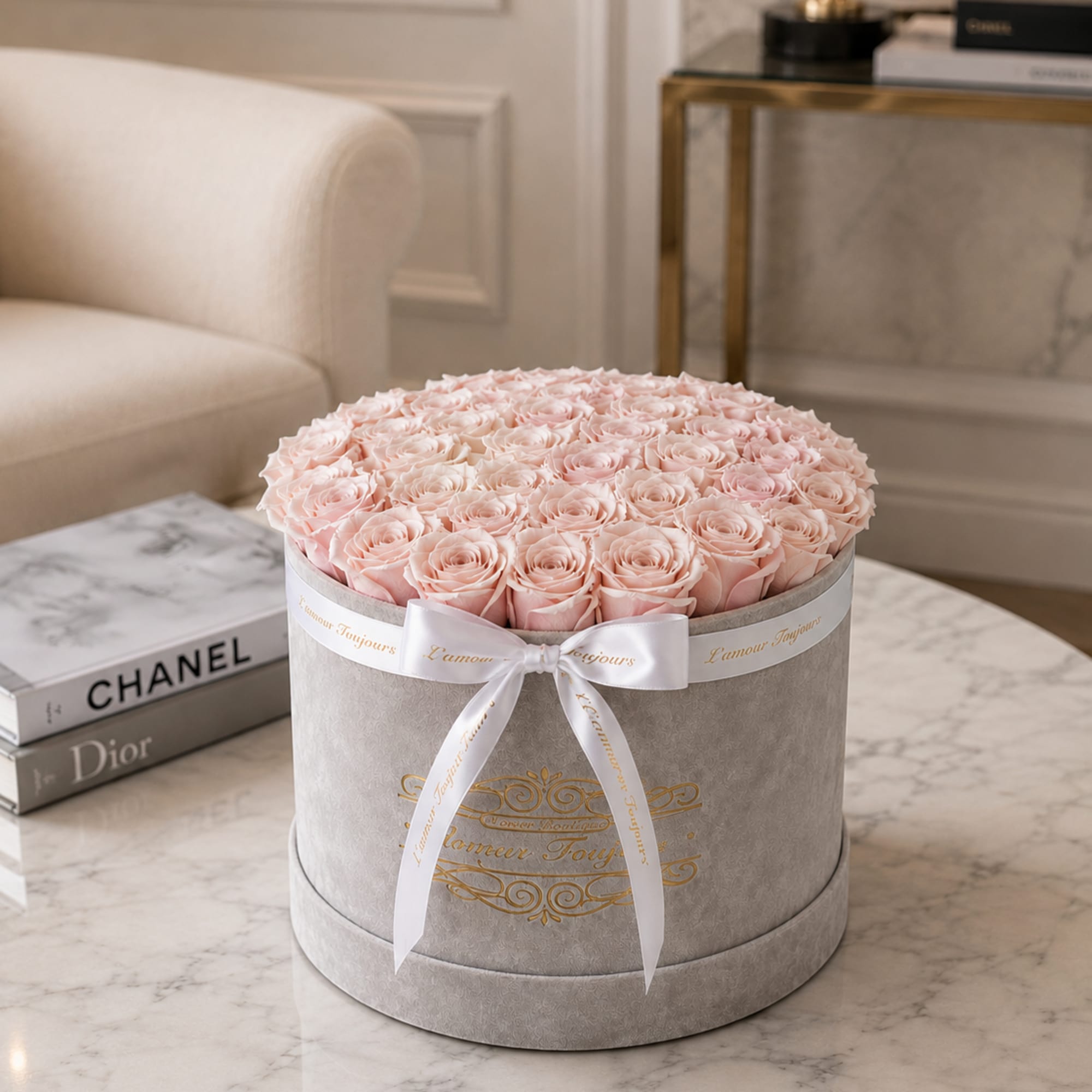 Round box of pale pink roses tied with a white ribbon, photo 2 of 3