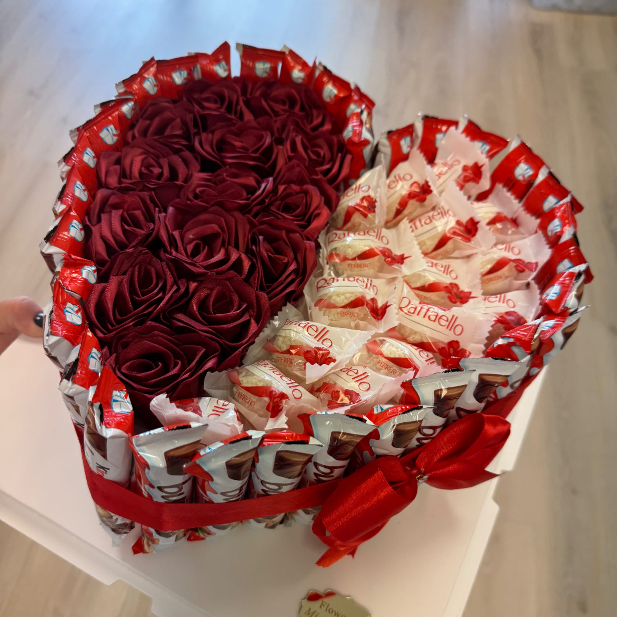 Heart-shaped gift box with red roses and Ferrero Rocher chocolates