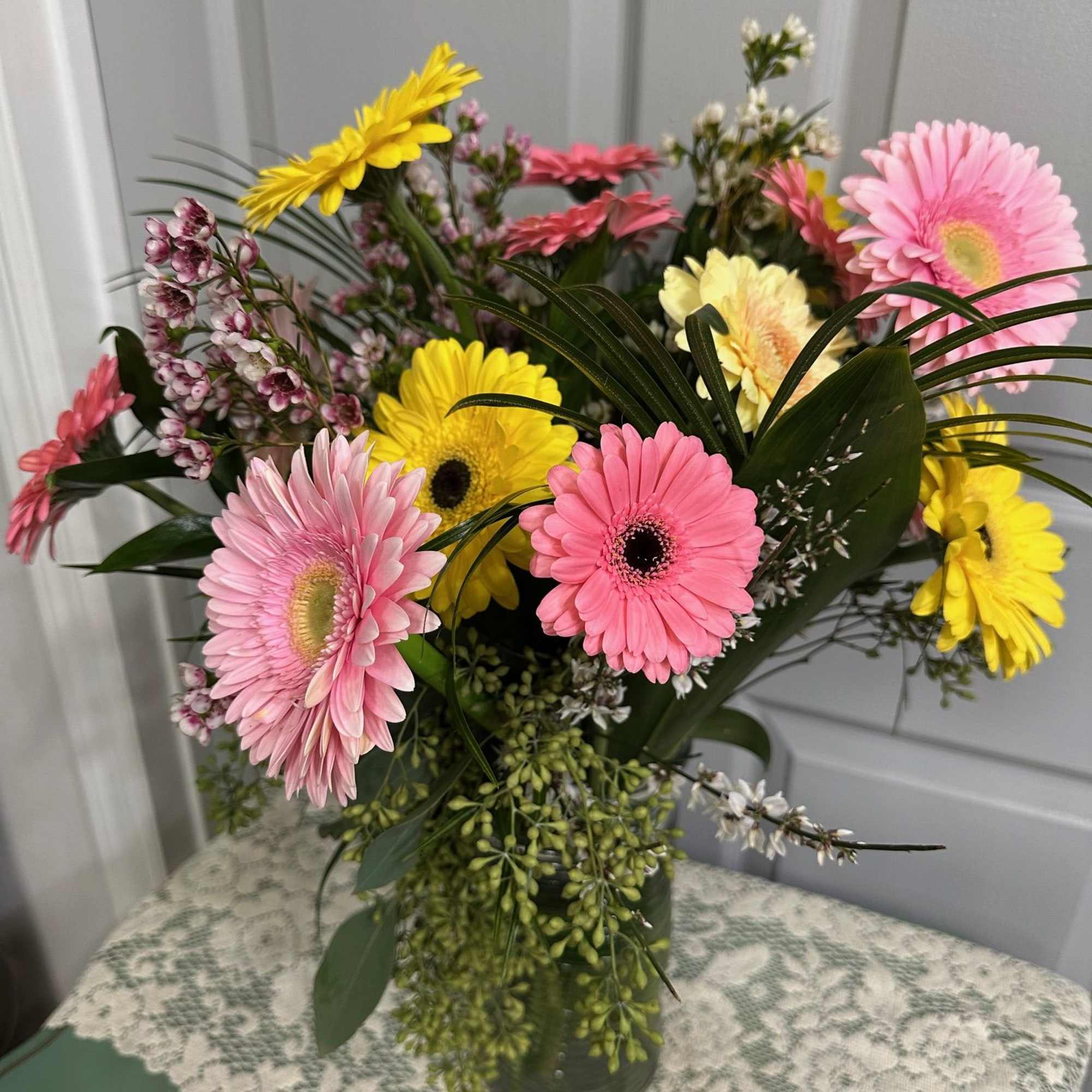 Mixed gerbera daisy bouquet in a glass vase