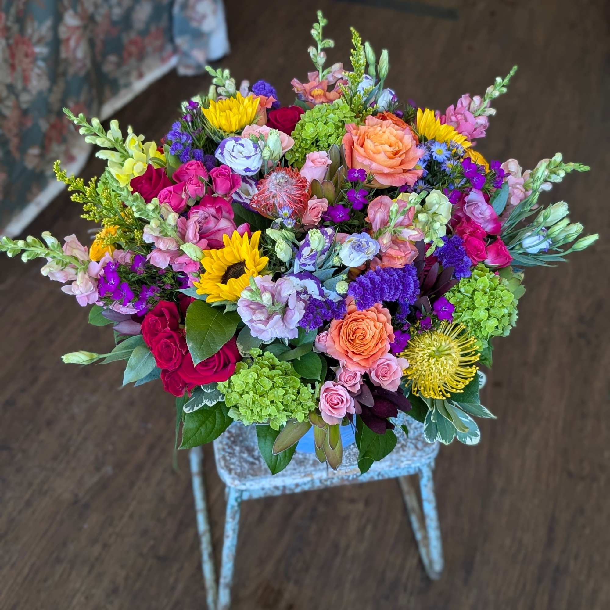 A lavish, garden-inspired statement arrangement designed to make someone feel truly celebrated, photo 2 of 3
