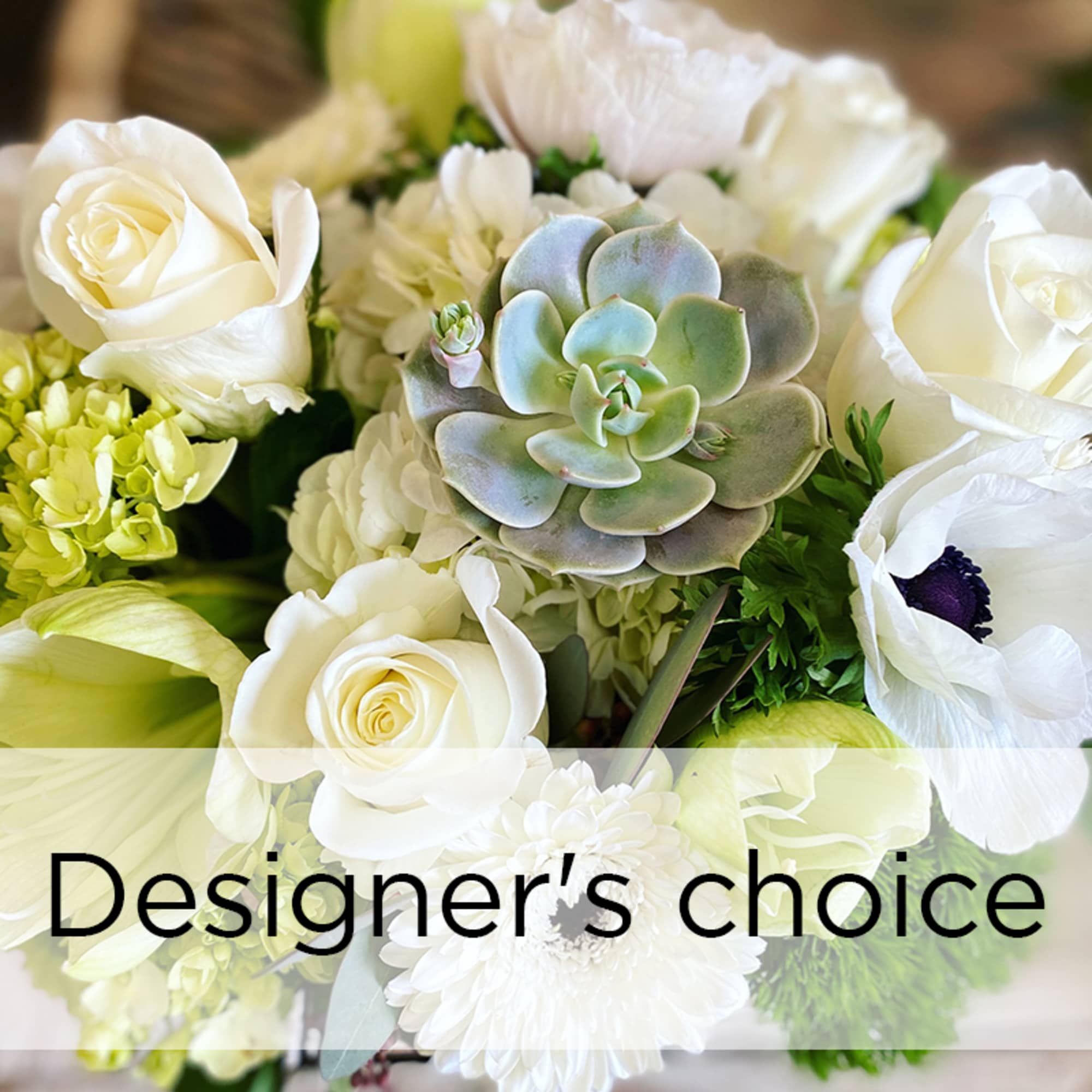 White roses and white anemones with a succulent centerpiece