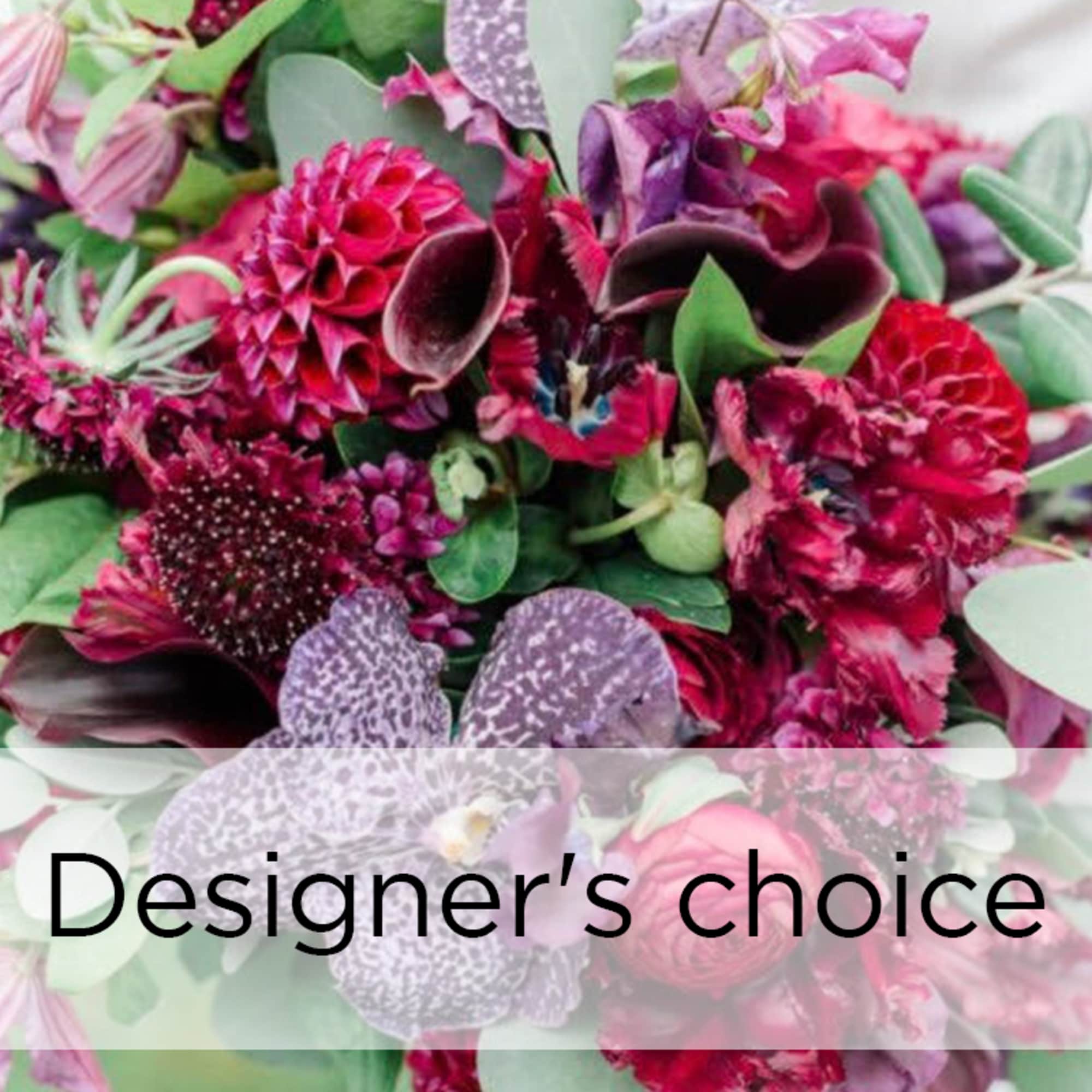 Mixed bouquet of pink and purple flowers with a designer's choice label