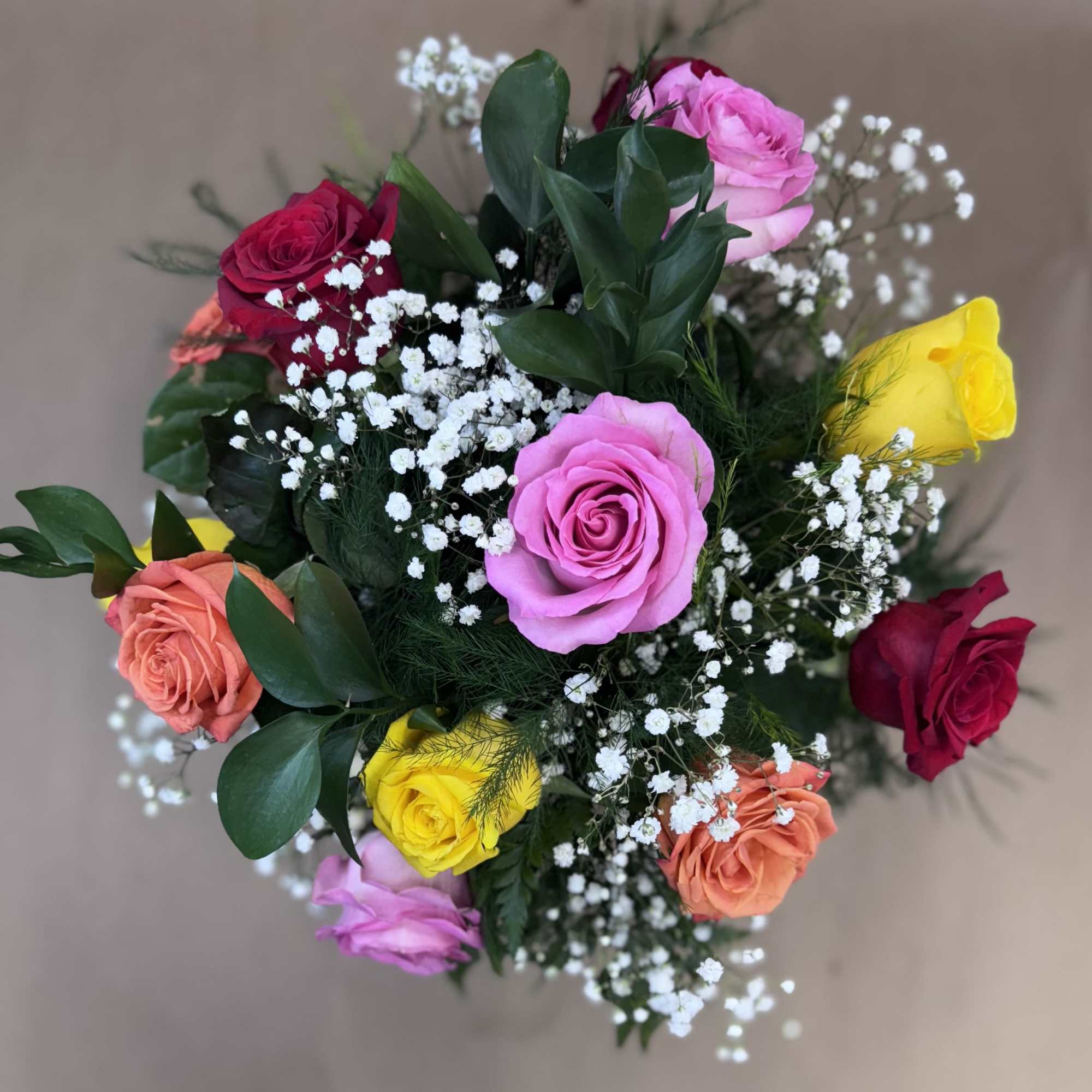 Bouquet of multicolored roses with baby's breath