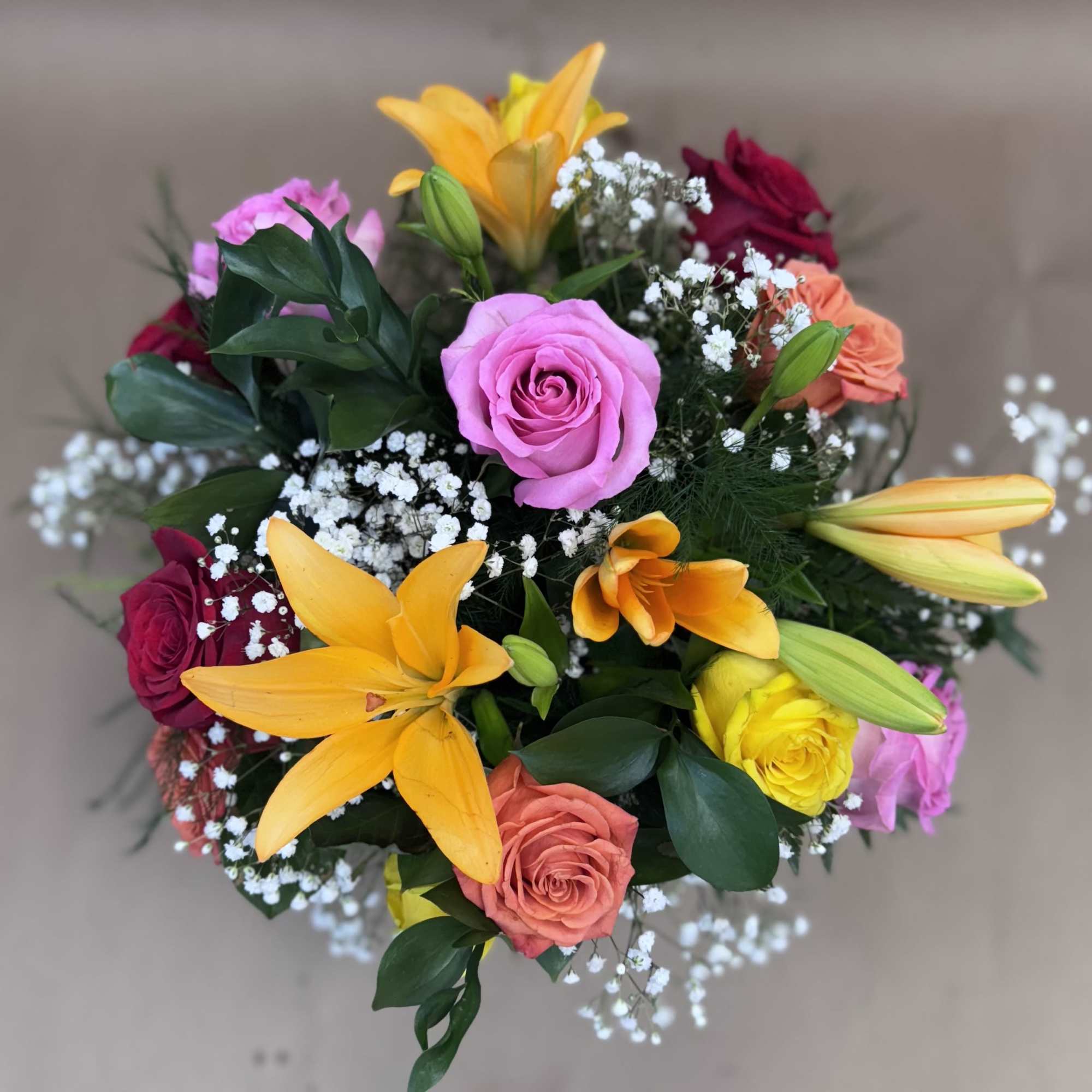 Mixed bouquet with roses, lilies, and baby's breath