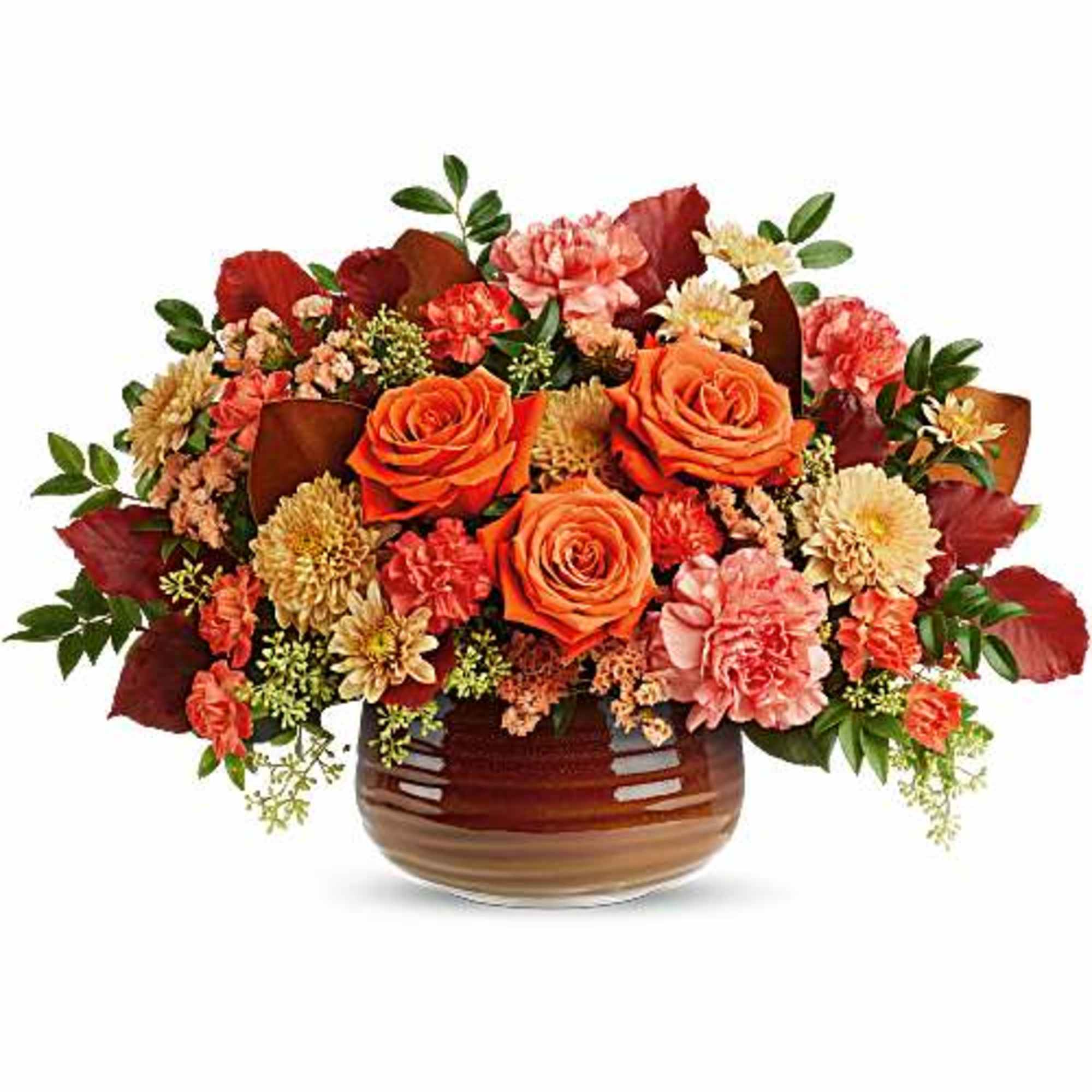 Orange roses and pink carnations in a brown glass vase