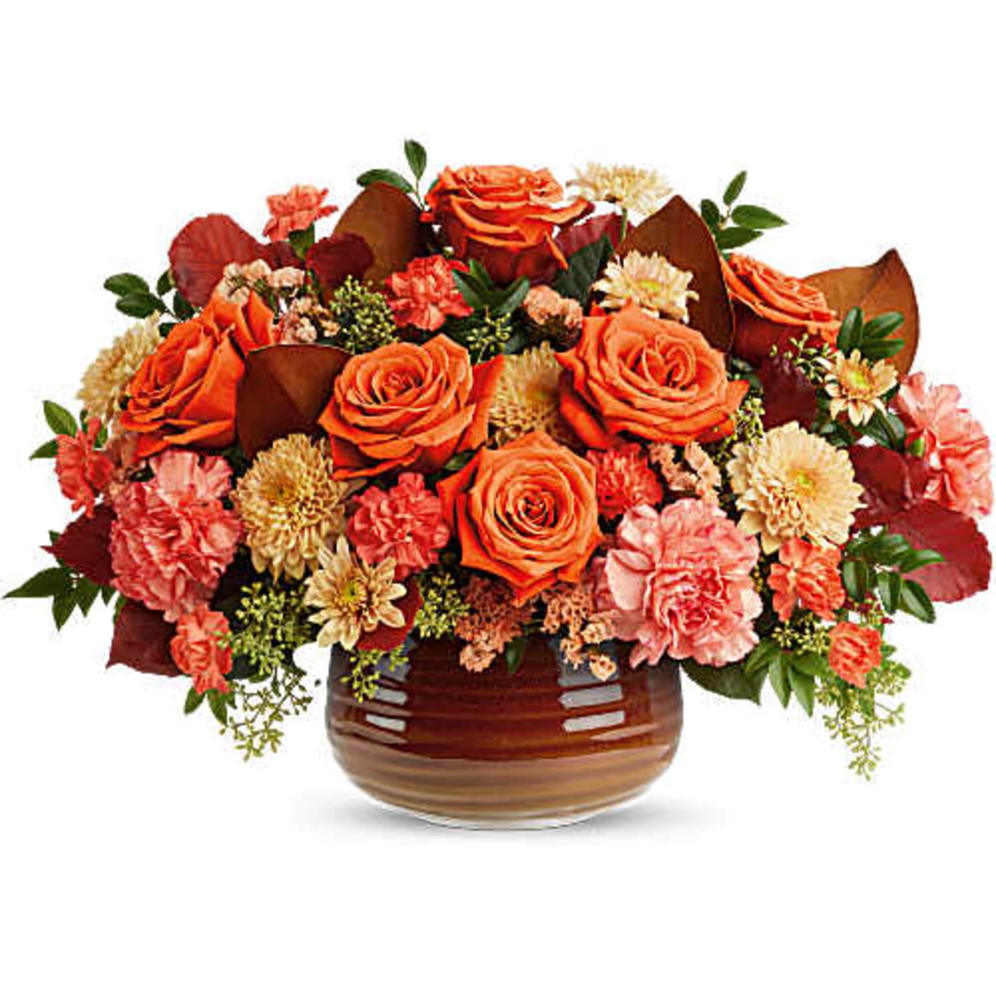 Orange roses and pink carnations arranged in a brown glass vase