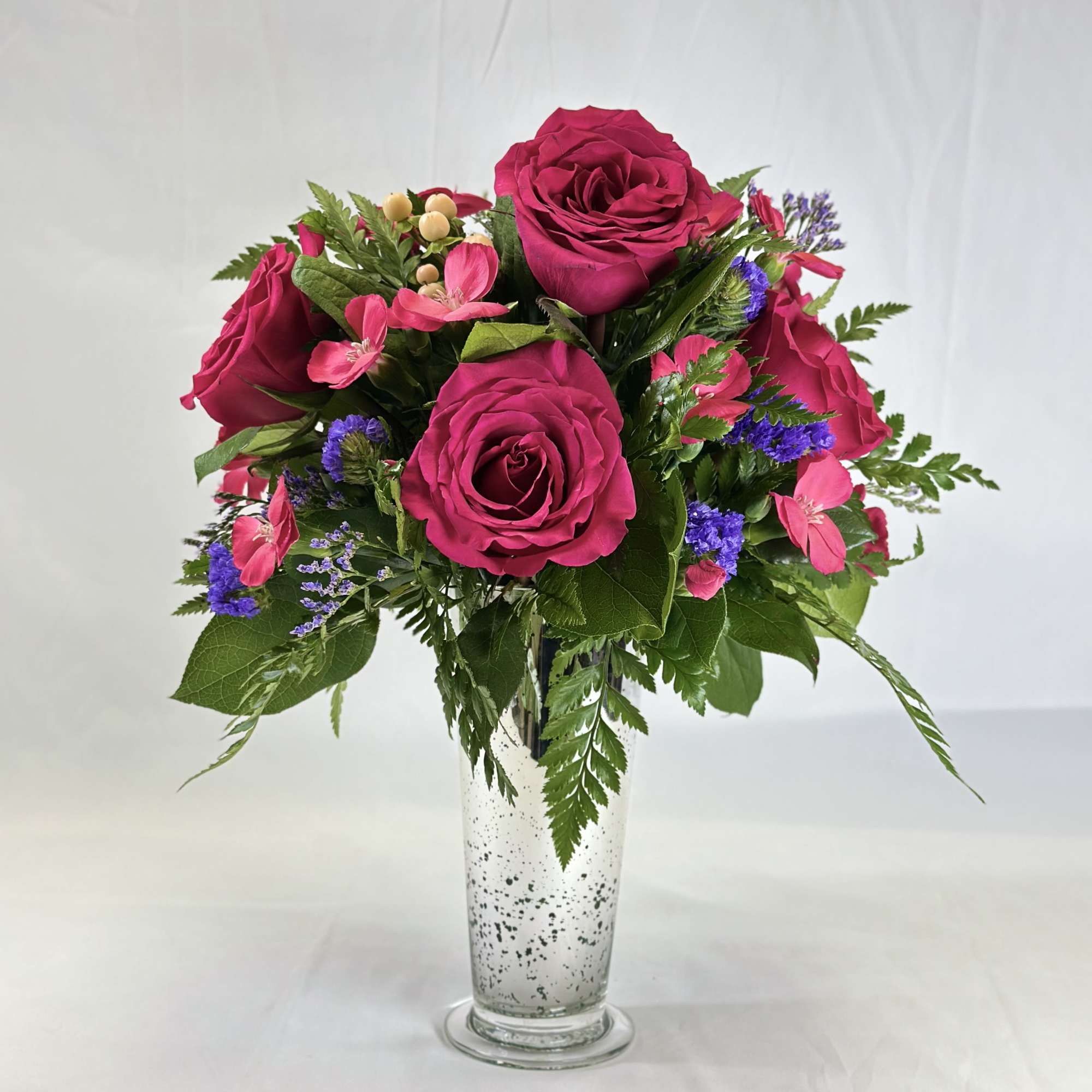 Pink rose bouquet in a clear glass vase
