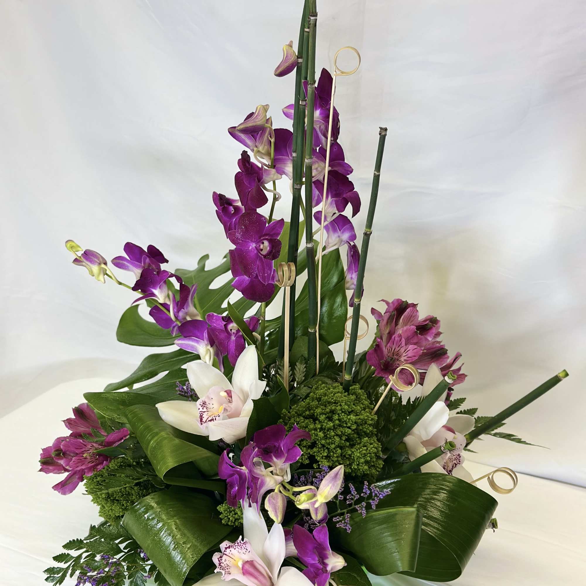 This is an absolutely stunning design featuring dendrobium and cymbidium orchids. The