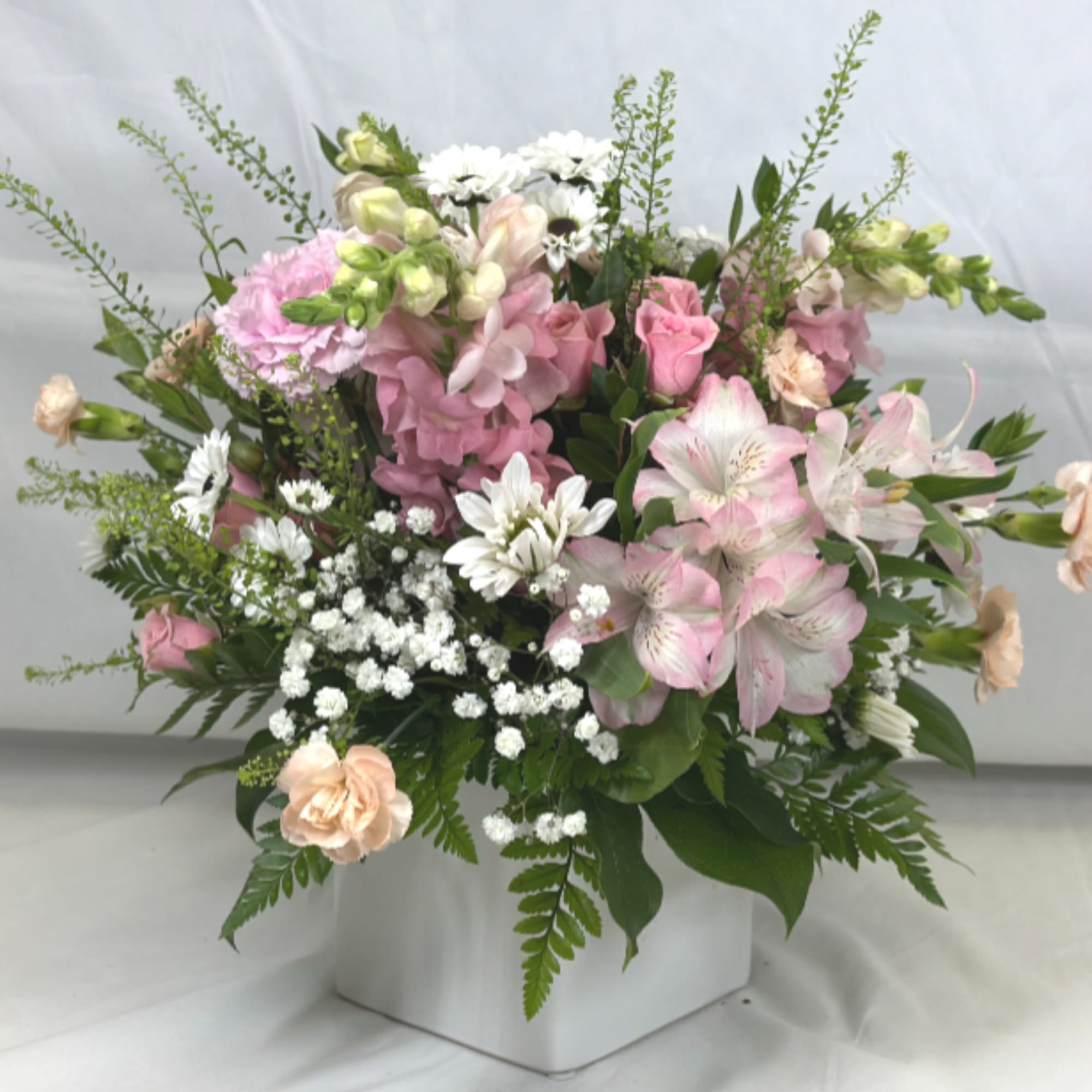 Lovely pink posies, with soft hues and gentle flowers are the hallmark
