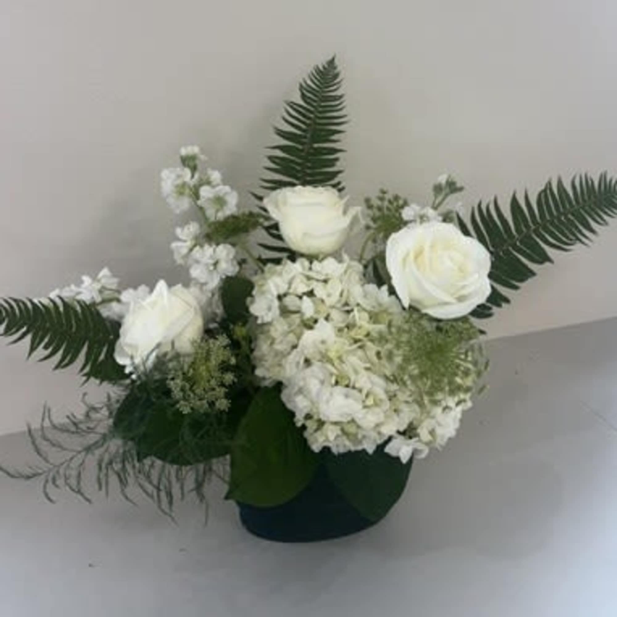 A lush and elegant arrangement designed to evoke the beauty of a