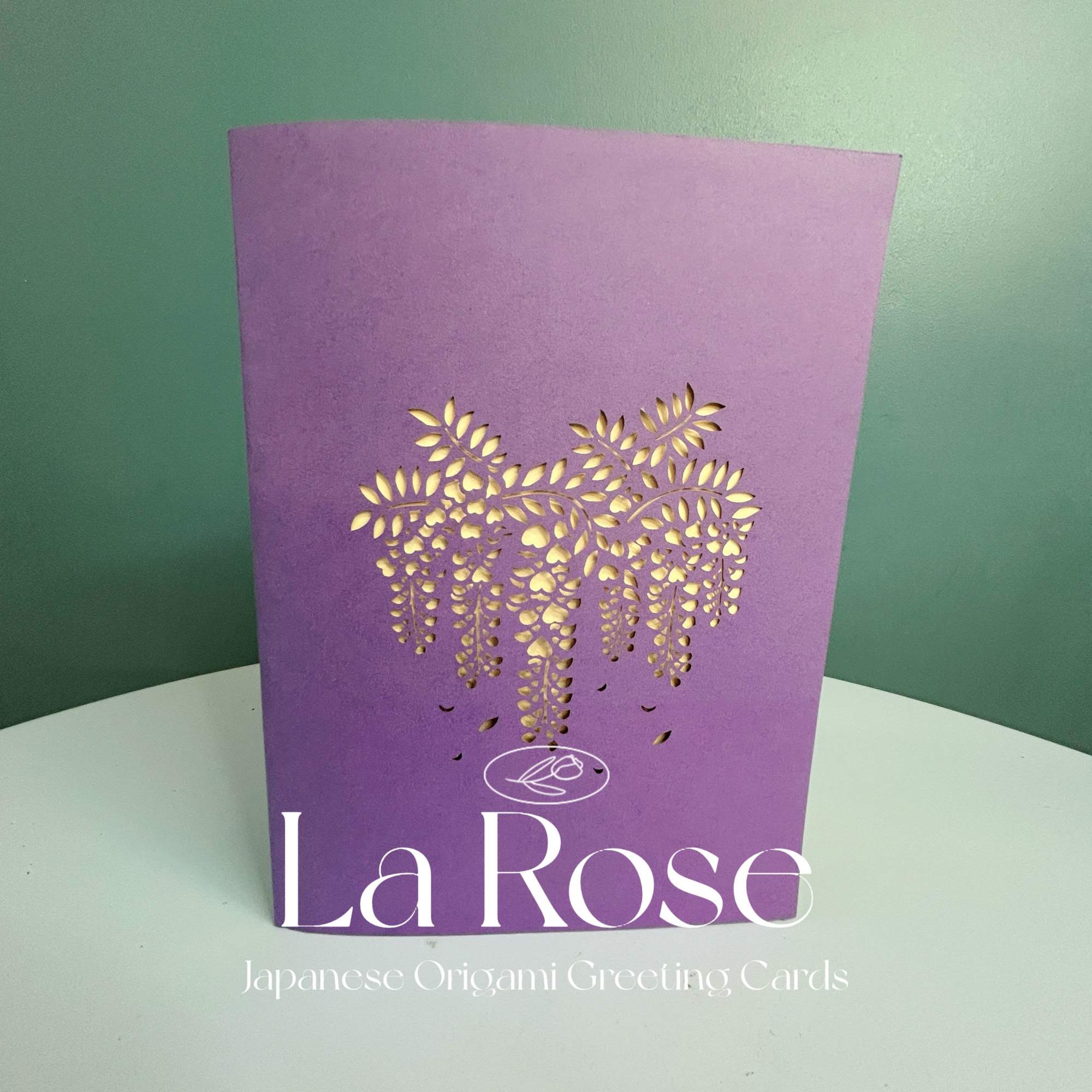 Purple greeting card with a gold floral cutout design