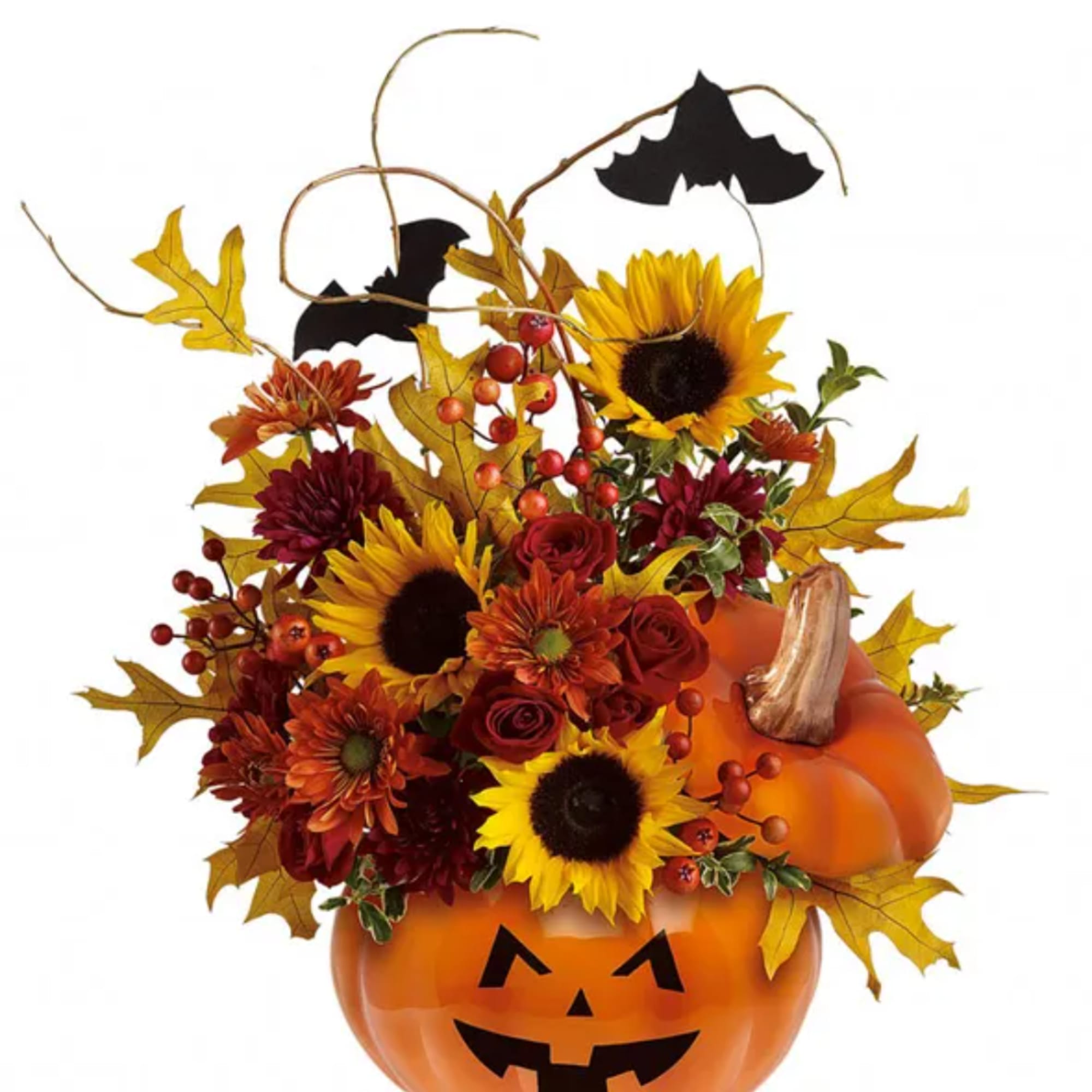 Halloween floral arrangement in a jack-o'-lantern container with sunflowers and red blooms