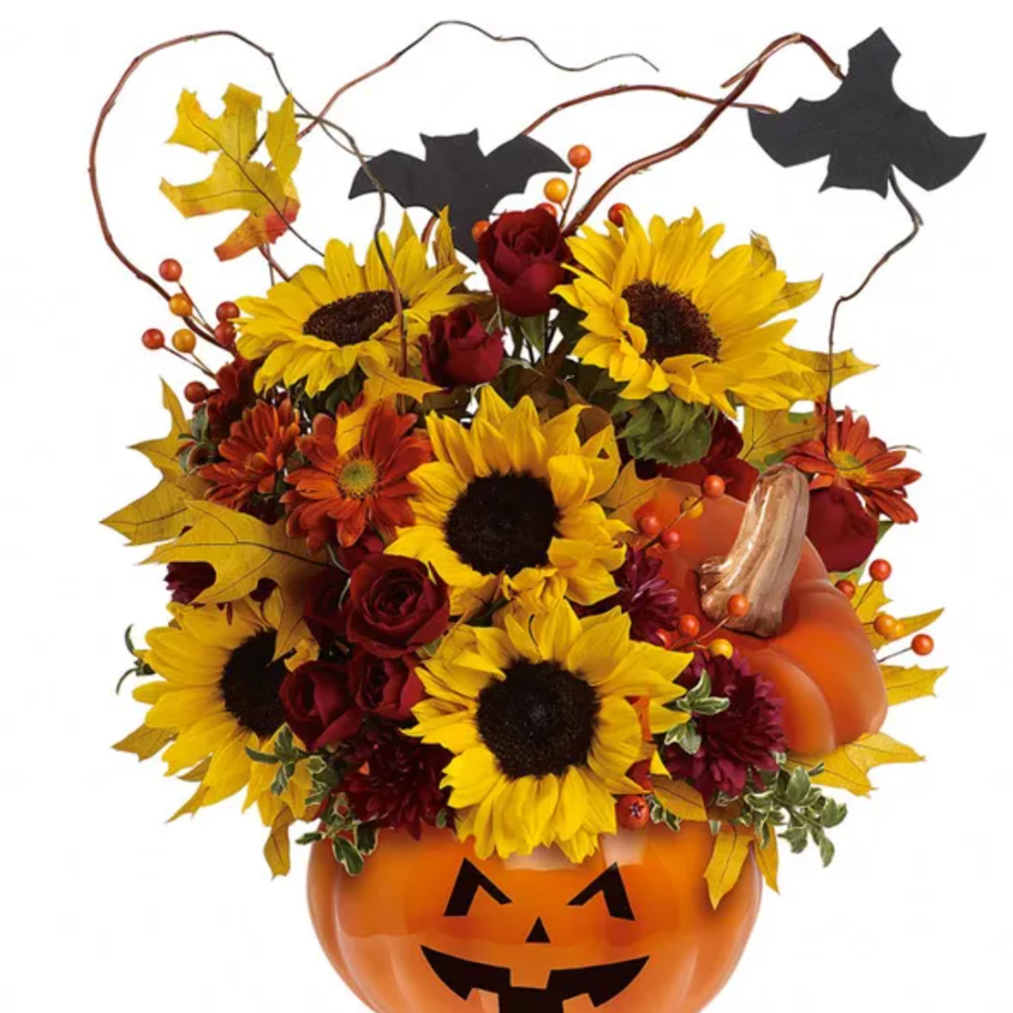 Sunflowers and red roses arranged in a jack-o'-lantern pumpkin container