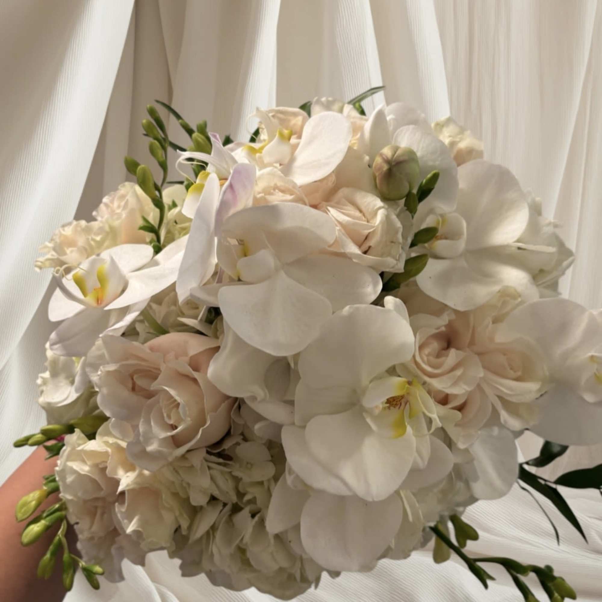 White orchid and pale blush rose bouquet